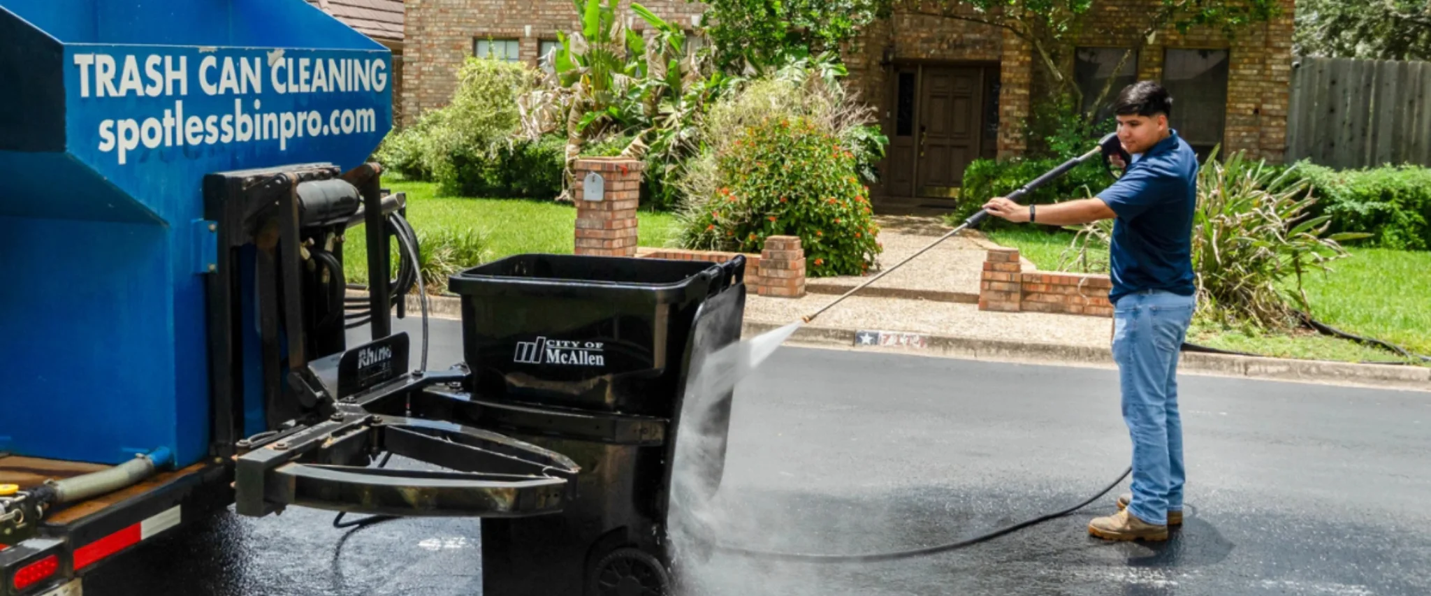 Pressure washing process used to clean and sanitize trash bins