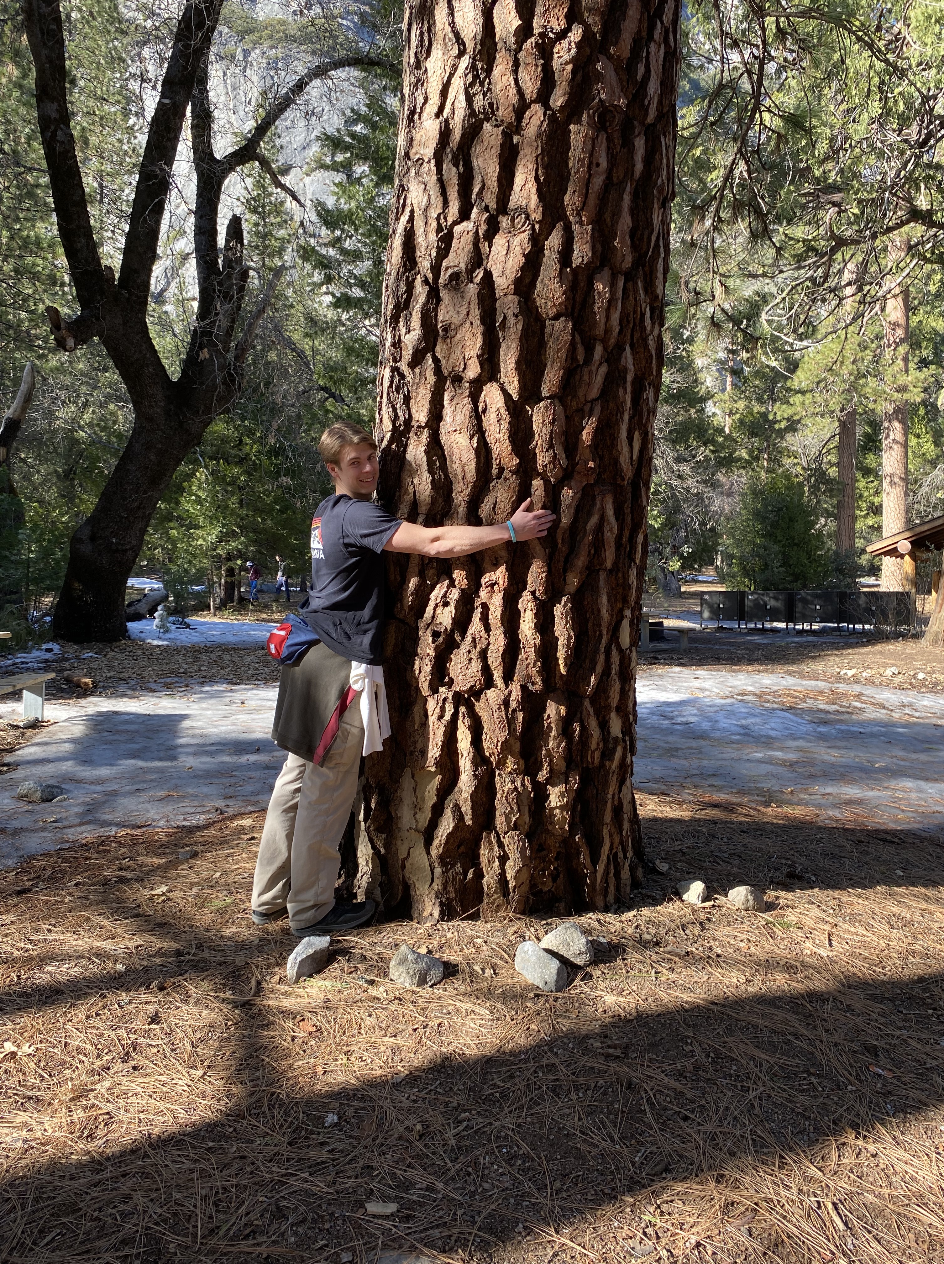 CHristian hugging a tree
