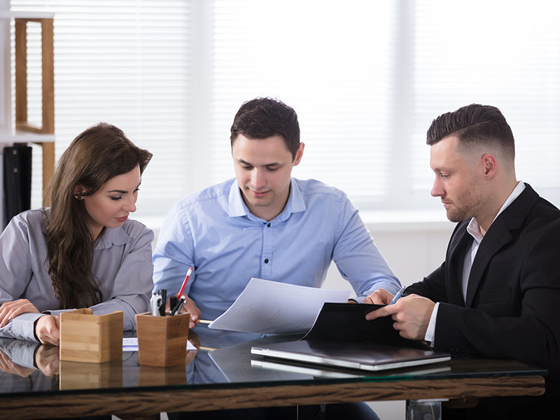 Advisor reviewing tax plan with small business owner