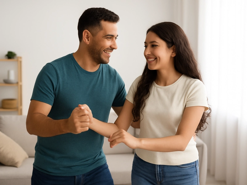 Father and daughter with Latino features practicing father-daughter dance in a living room Father and daughter with Latino features practicing father-daughter dance in a living room