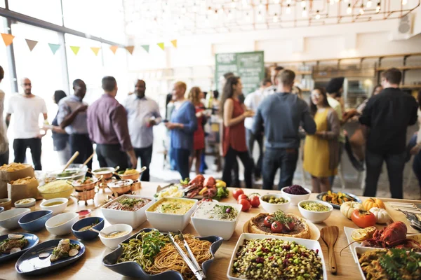 A well-arranged buffet table with an assortment of budget-friendly dishes A well-arranged buffet table with an assortment of budget-friendly dishes