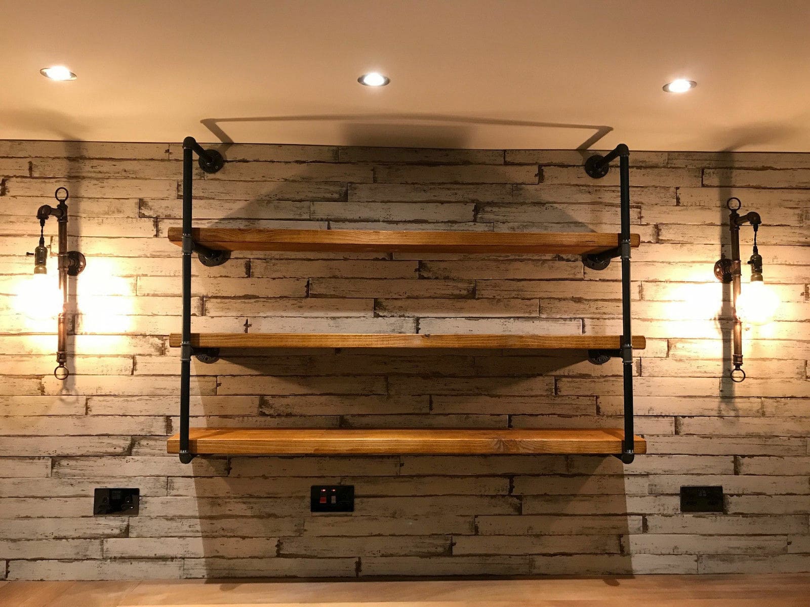 a wood shelves on a brick wall