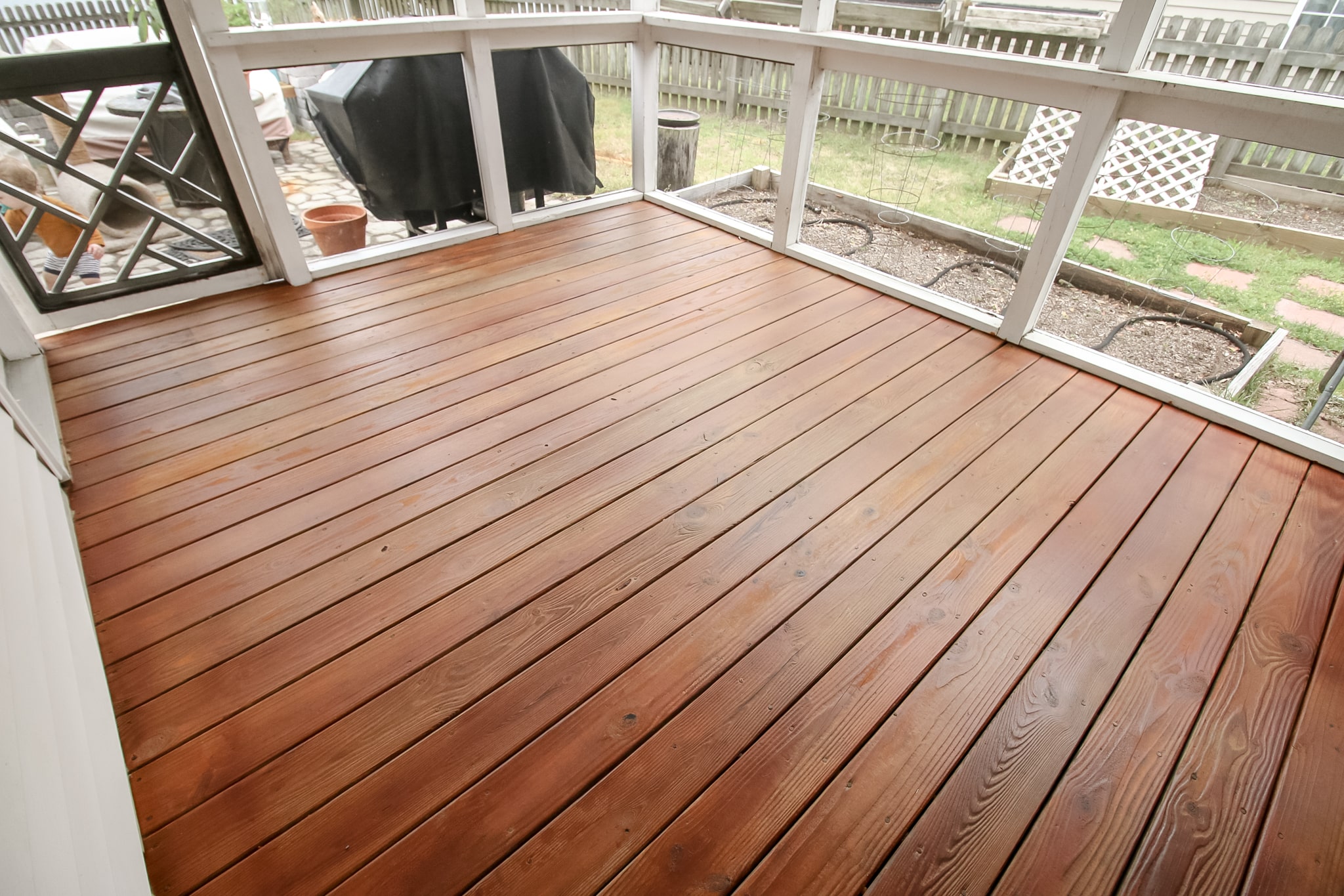 a deck with a white railing