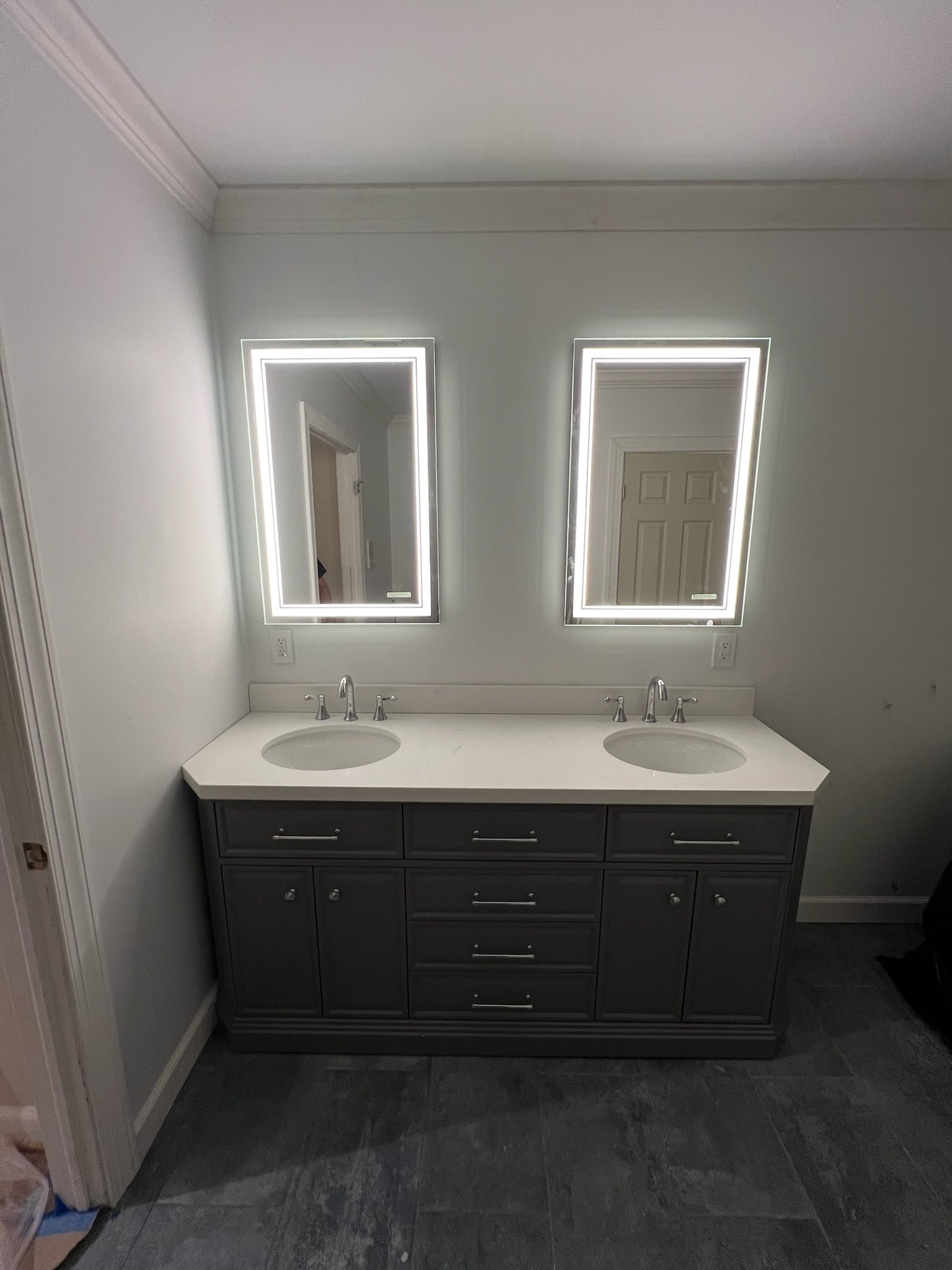 double sink with well-lit mirrors