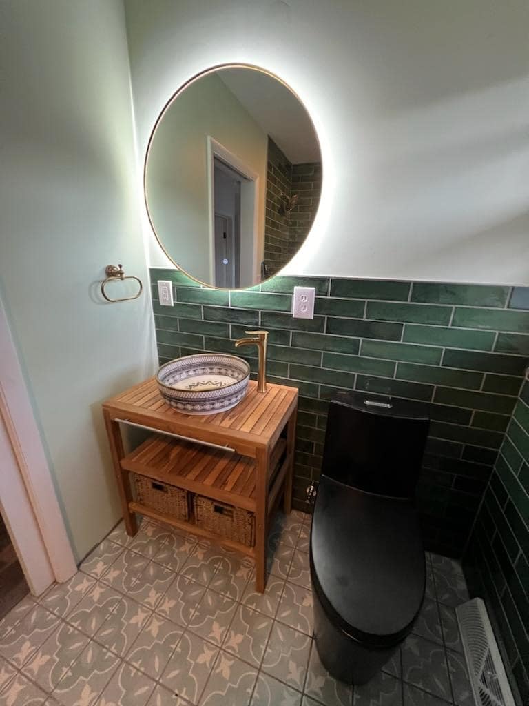 double sink with well-lit mirrors