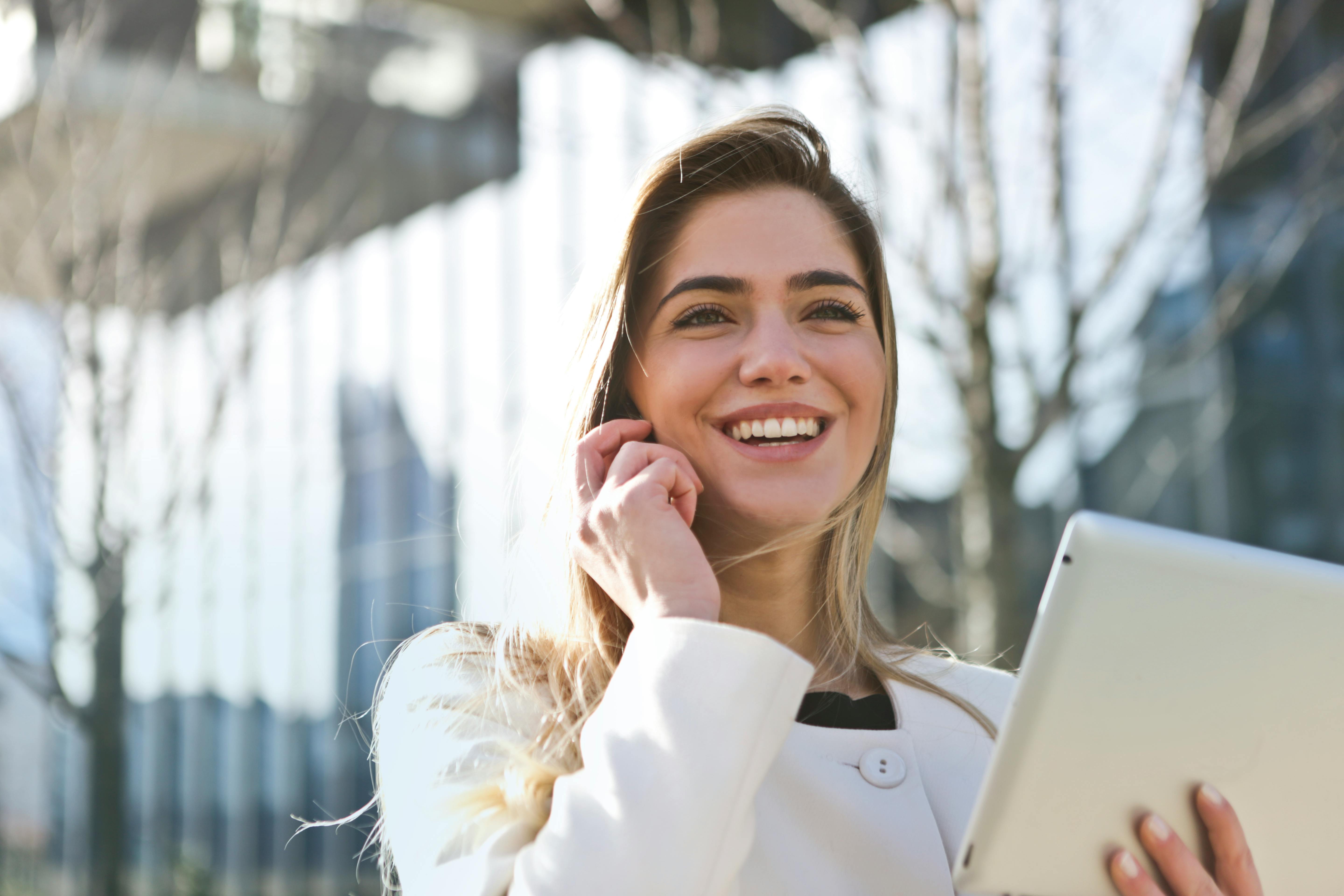 Woman on phone ready to shift her money mindset Woman on phone ready to shift her money mindset