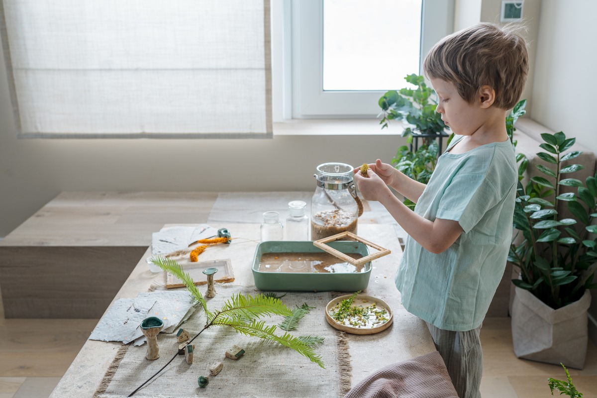 boy making terrarium as fun summer project