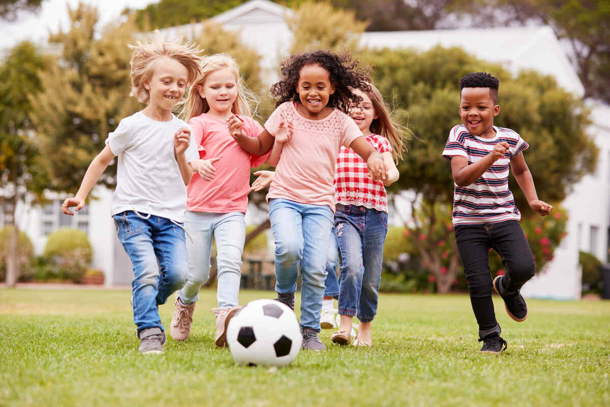 older children playing soccer