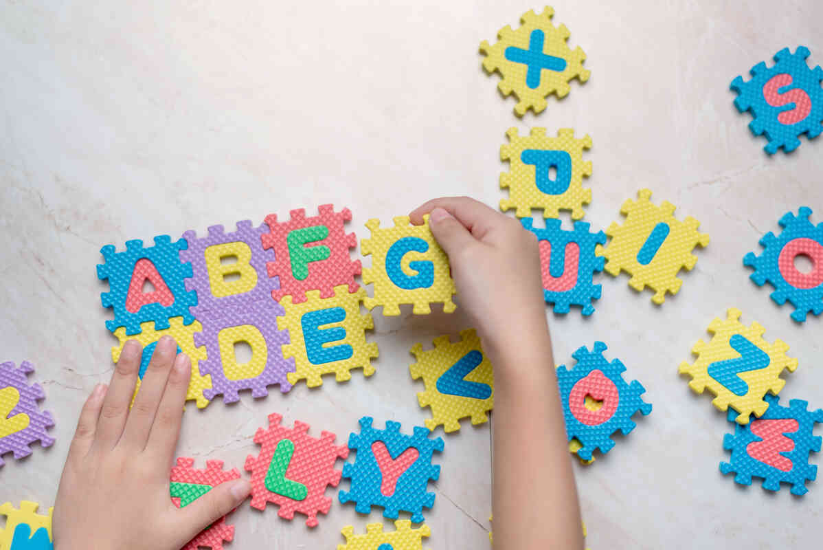 child-play-alphabet-puzzle-at-daycare
