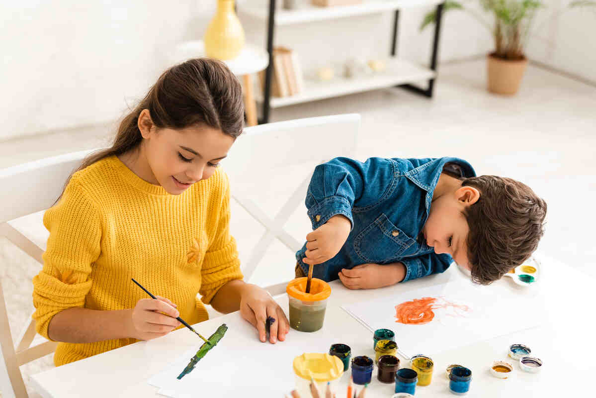 cute-boy-mixing-paints-in-container- ideas-for-after-school-activities