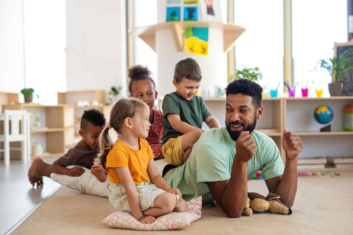 nursery-children-with-man-teacher-improve-kindergarten-skills