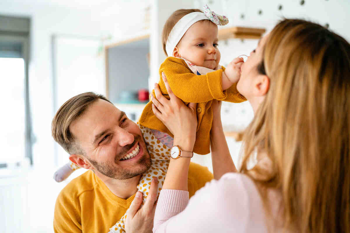 proud-mother-and-father-smiling-build-emotional-regulation