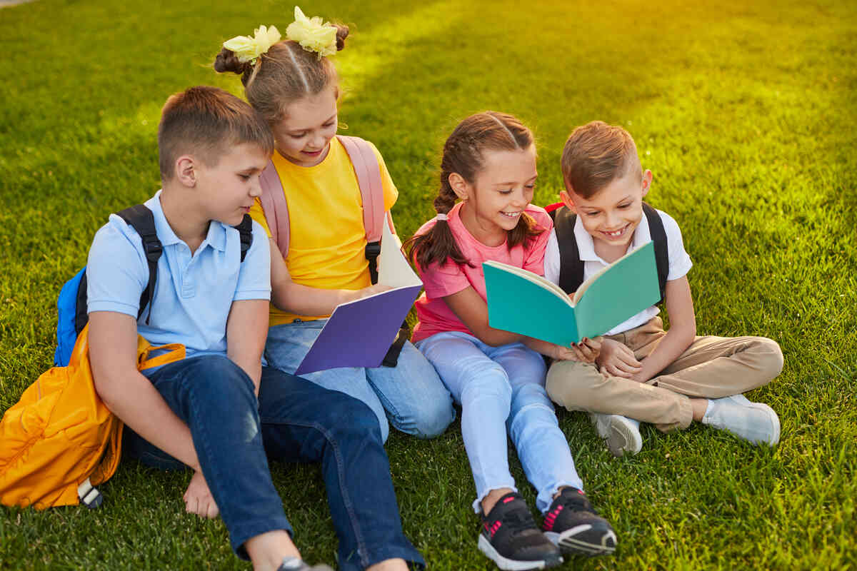 smiling-child-holding-summer-reading-books-for-kids-at-library
