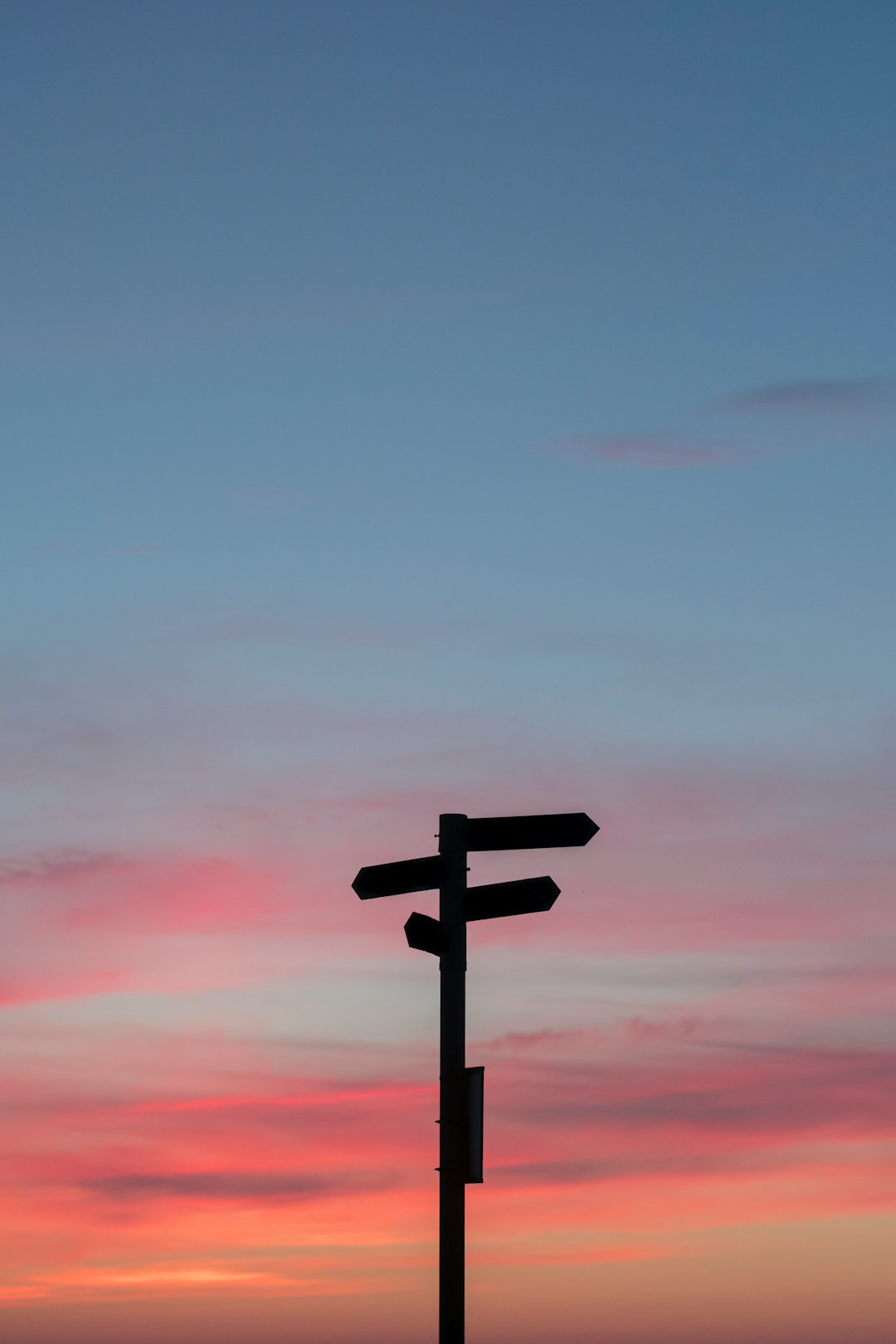 a direction sign with multiple arrows