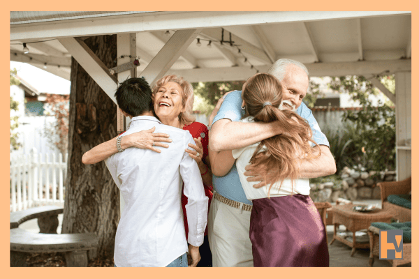 Seniors smiling with family outdoors Seniors smiling with family outdoors