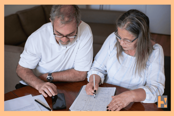 Elderly Canadian couple reviewing pension Elderly Canadian couple reviewing pension