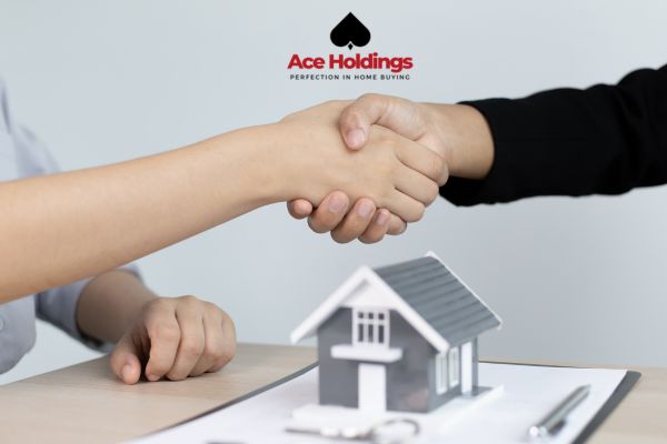 shaking hands with a tiny house