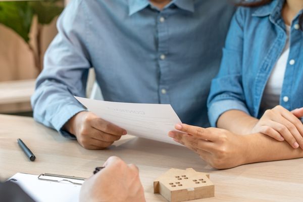 Couple reviewing real estate contract