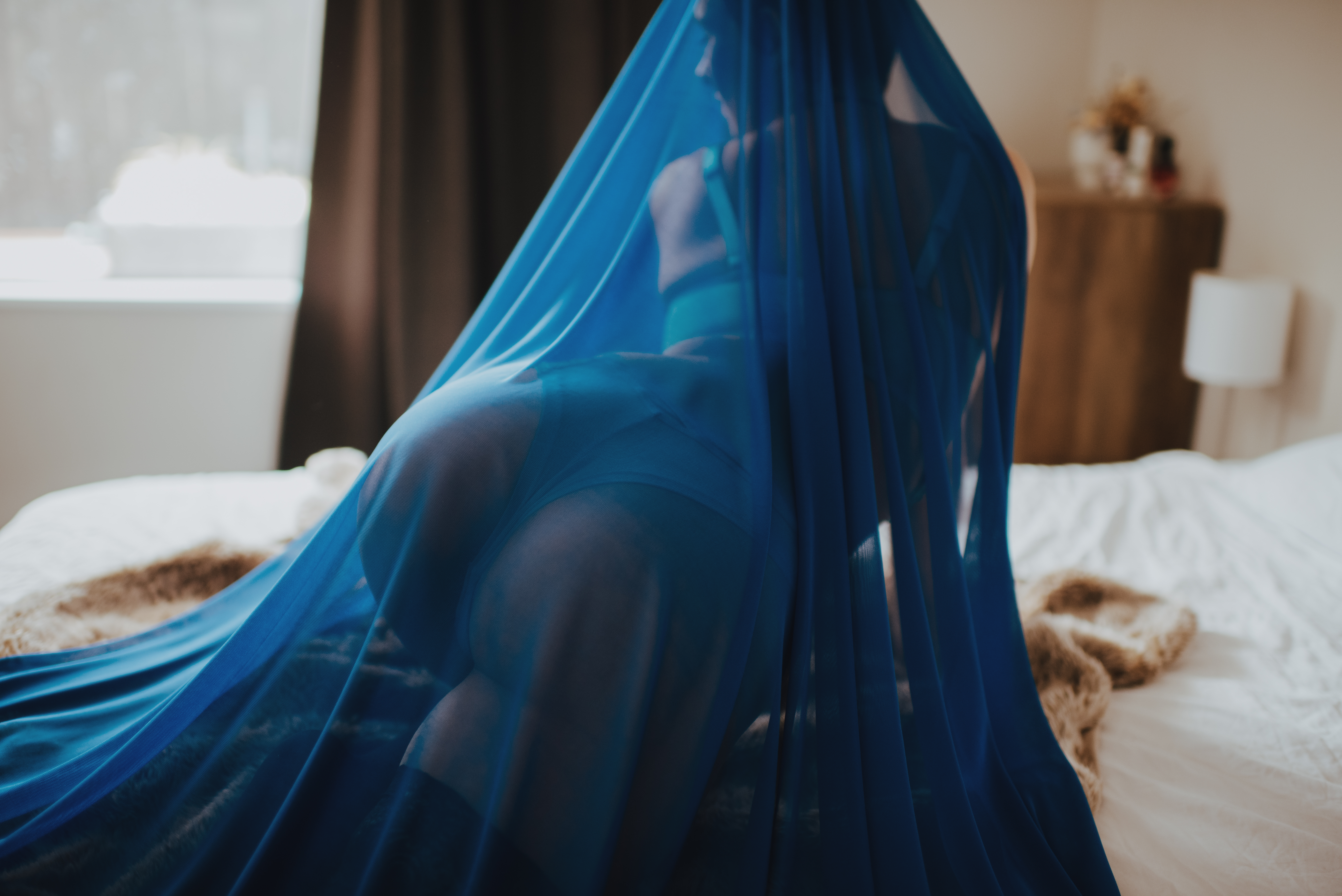 playing with sheer fabric for boudoir photoshoot