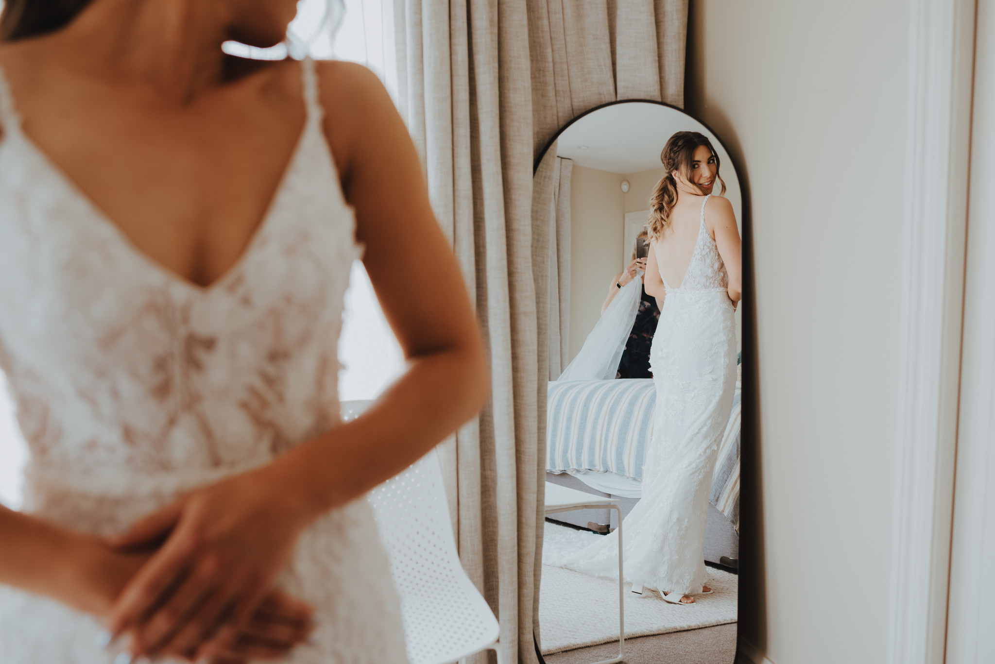 bride checking out her wedding dress