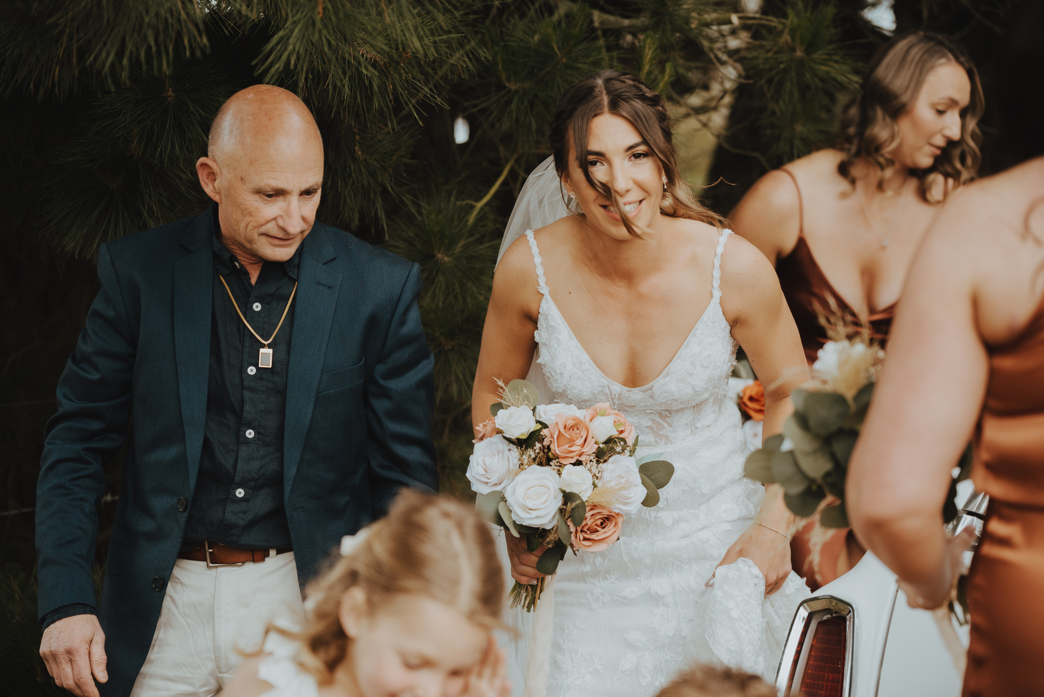bride exiting the wedding car