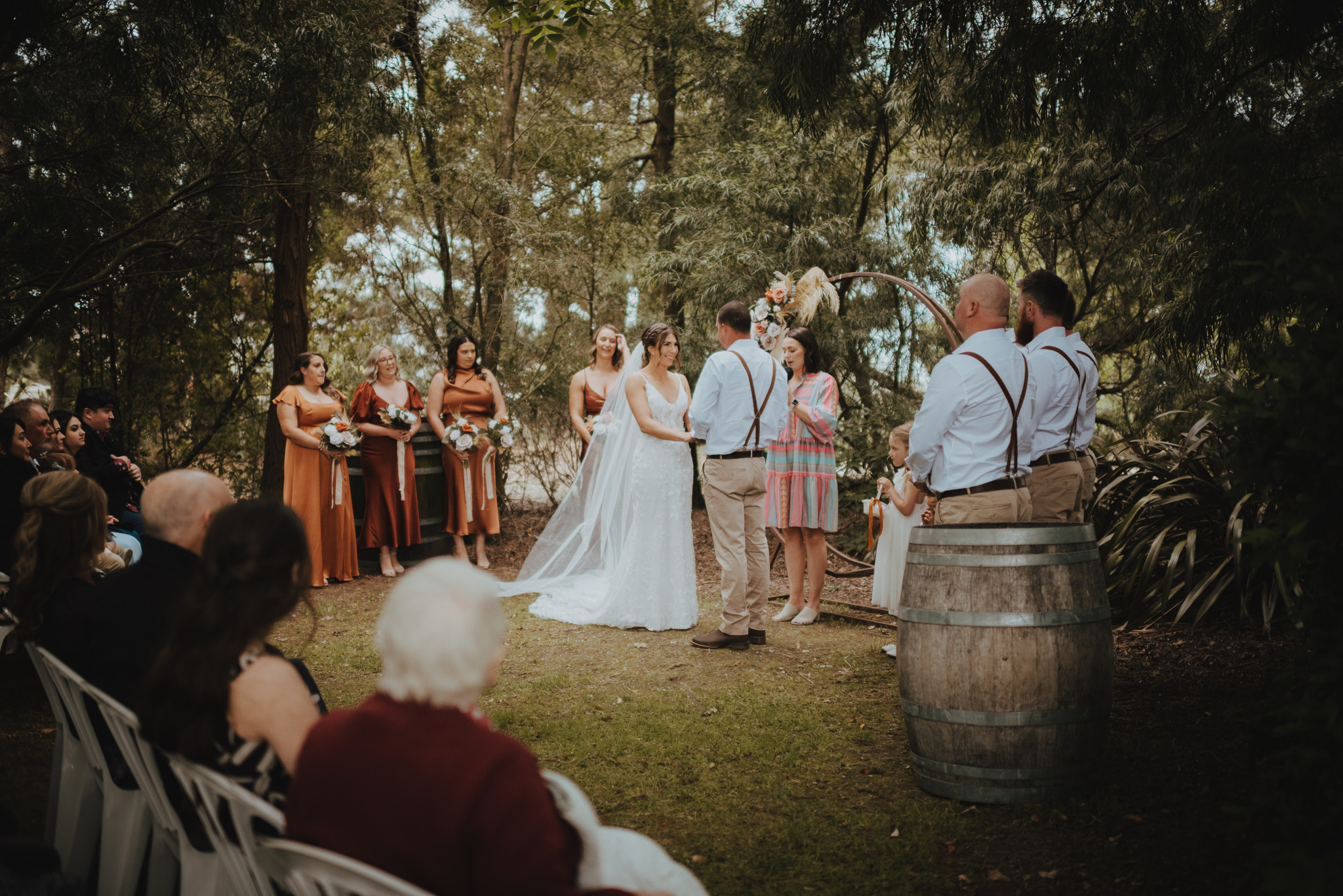 wedding ceremony under the tree canopy at darjon vineyard
