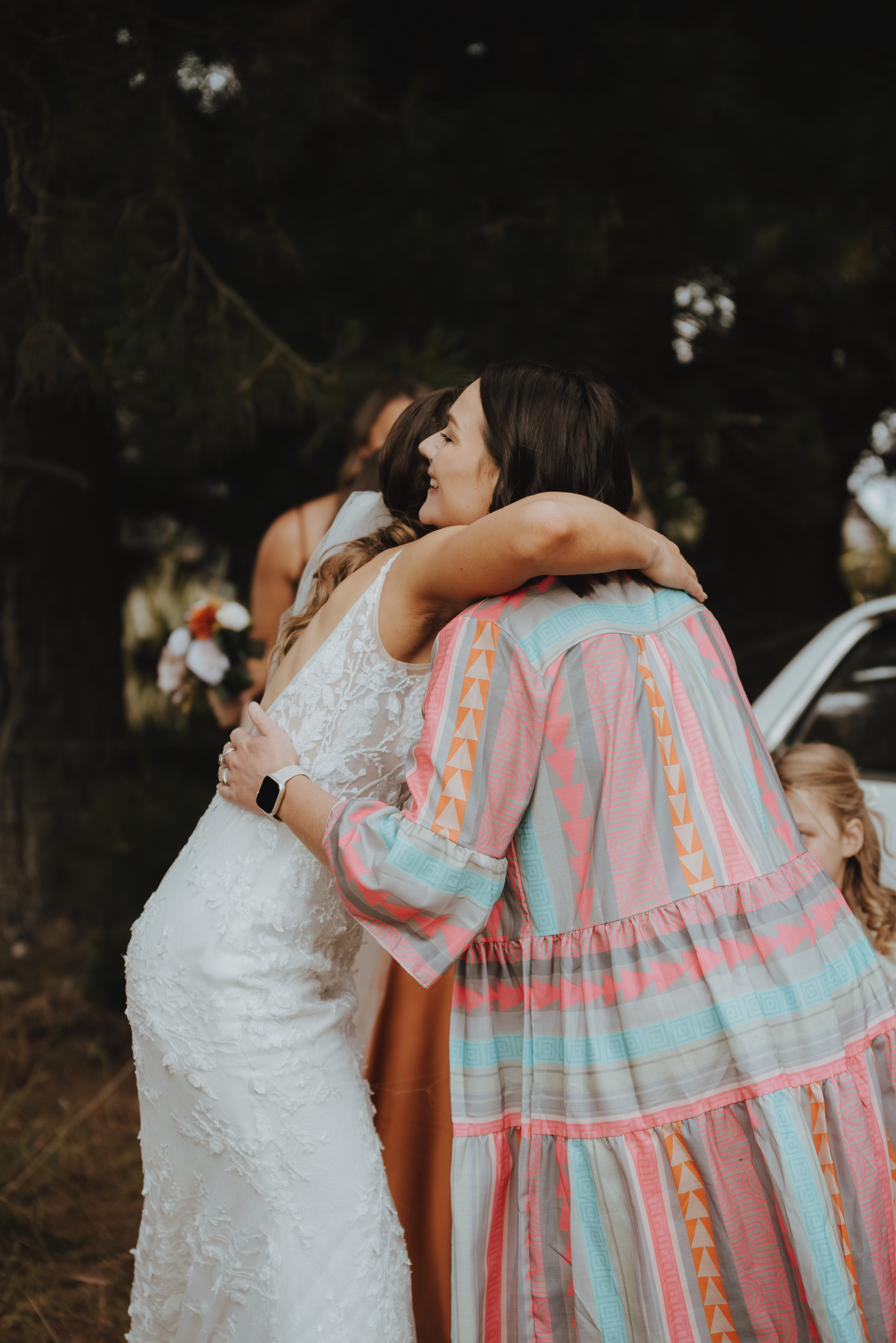 brit the celebrant hugging a bride