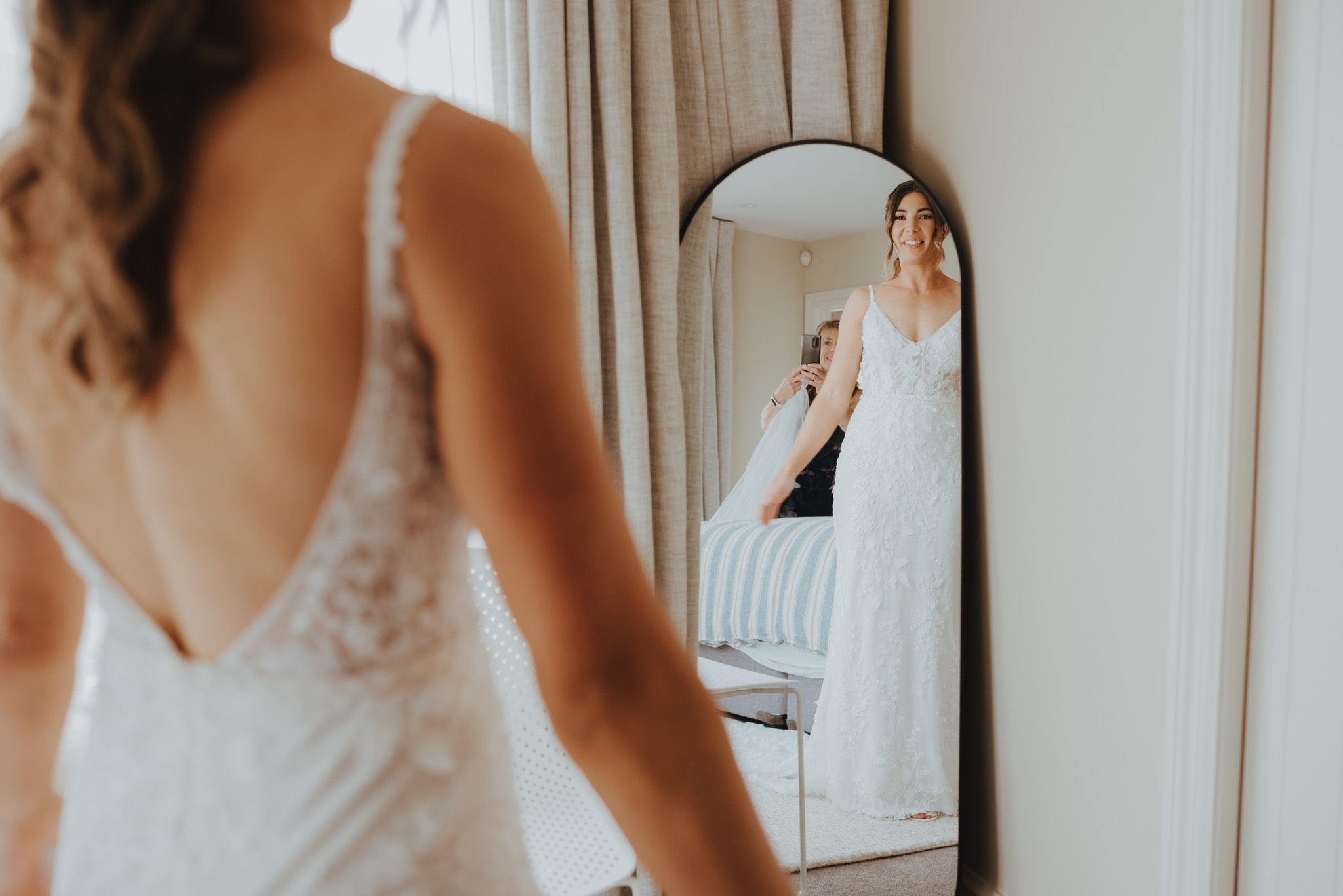 bride checking out her fit and flare wedding dress