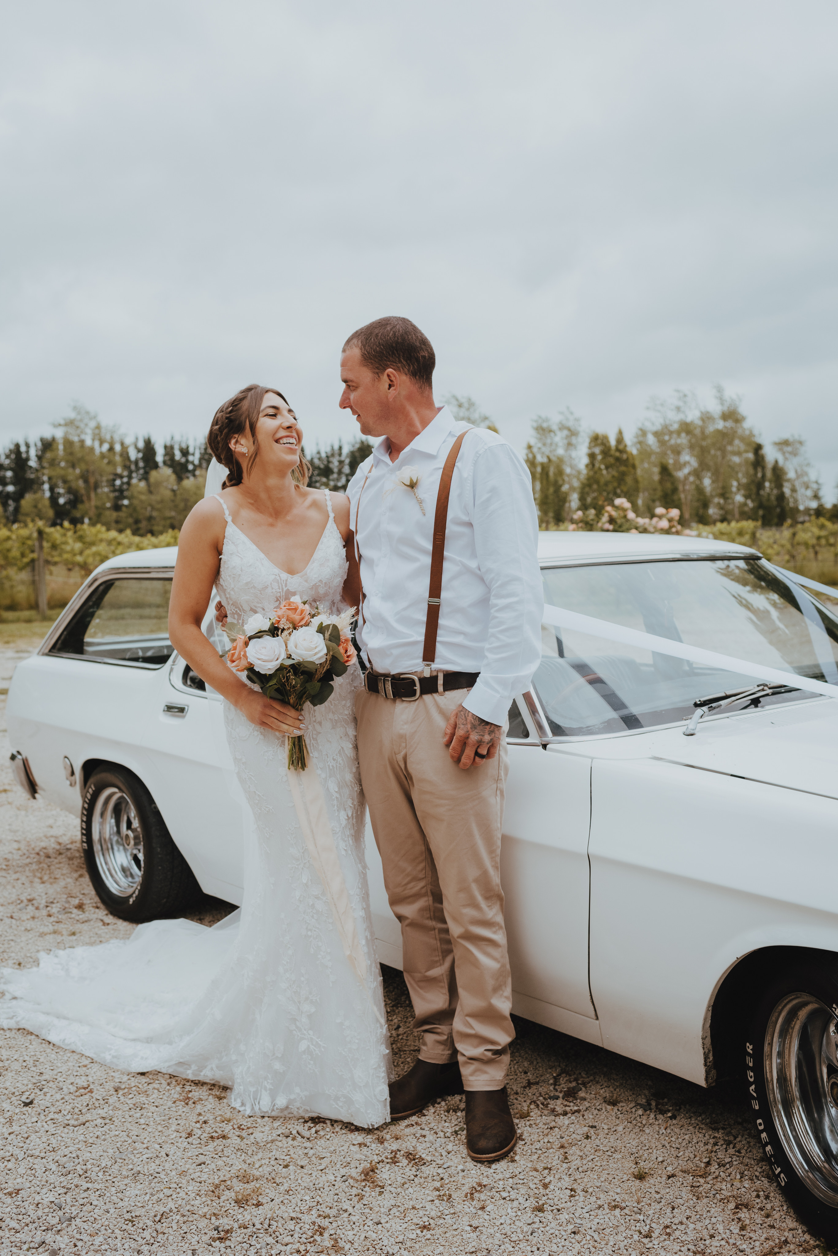 newlyweds cuddling up for photos after the ceremony