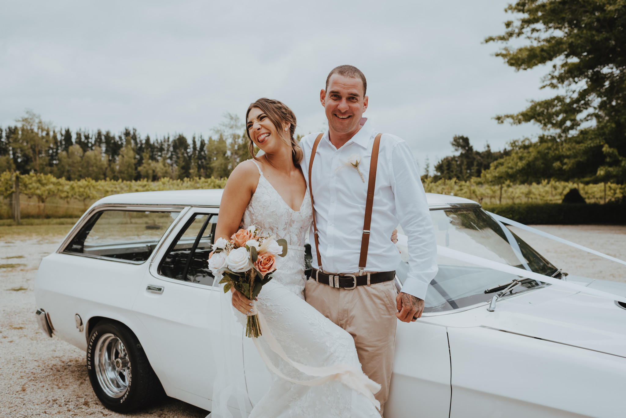 newlyweds laughing for wedding photos