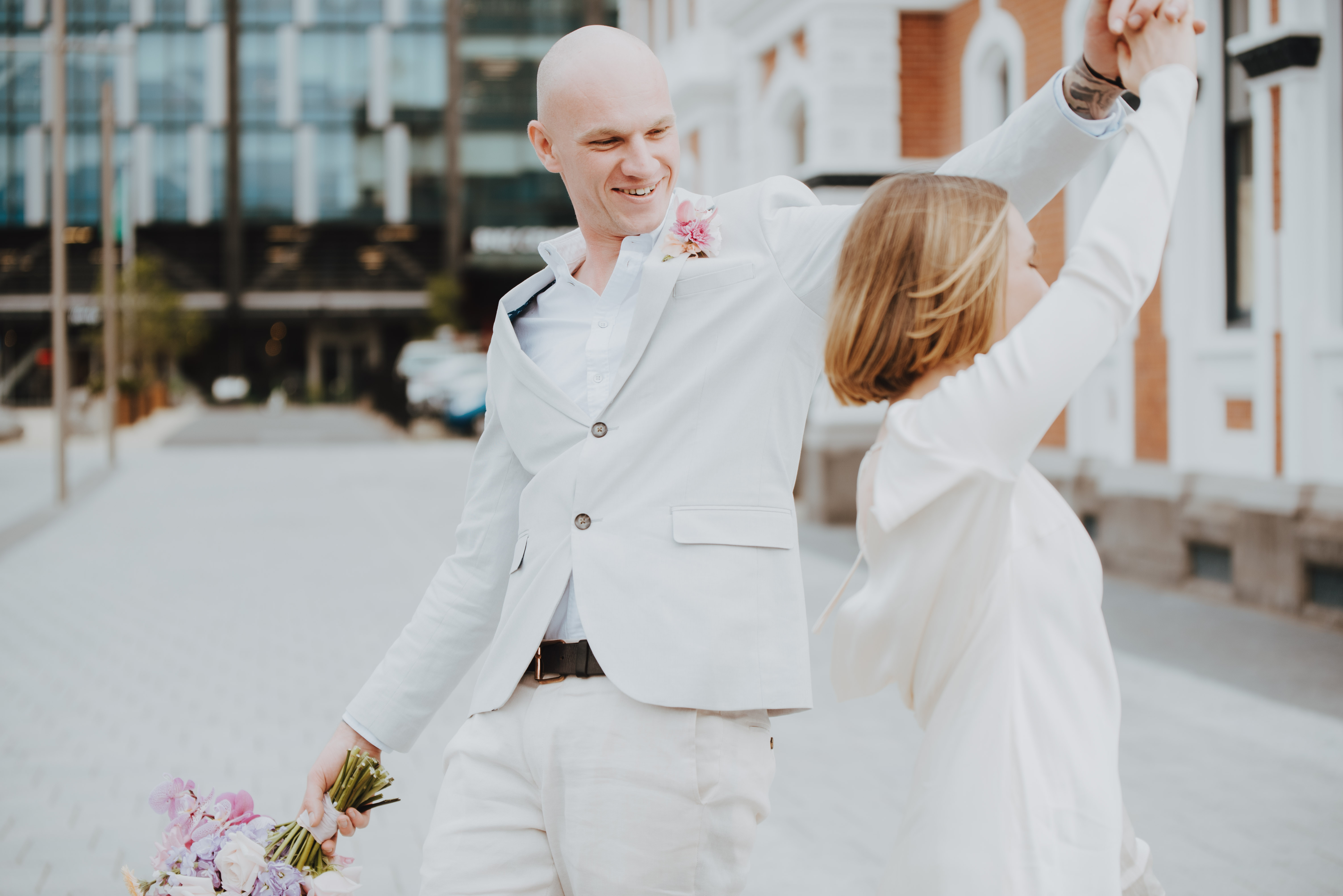 couple dancing for newlywed portraits