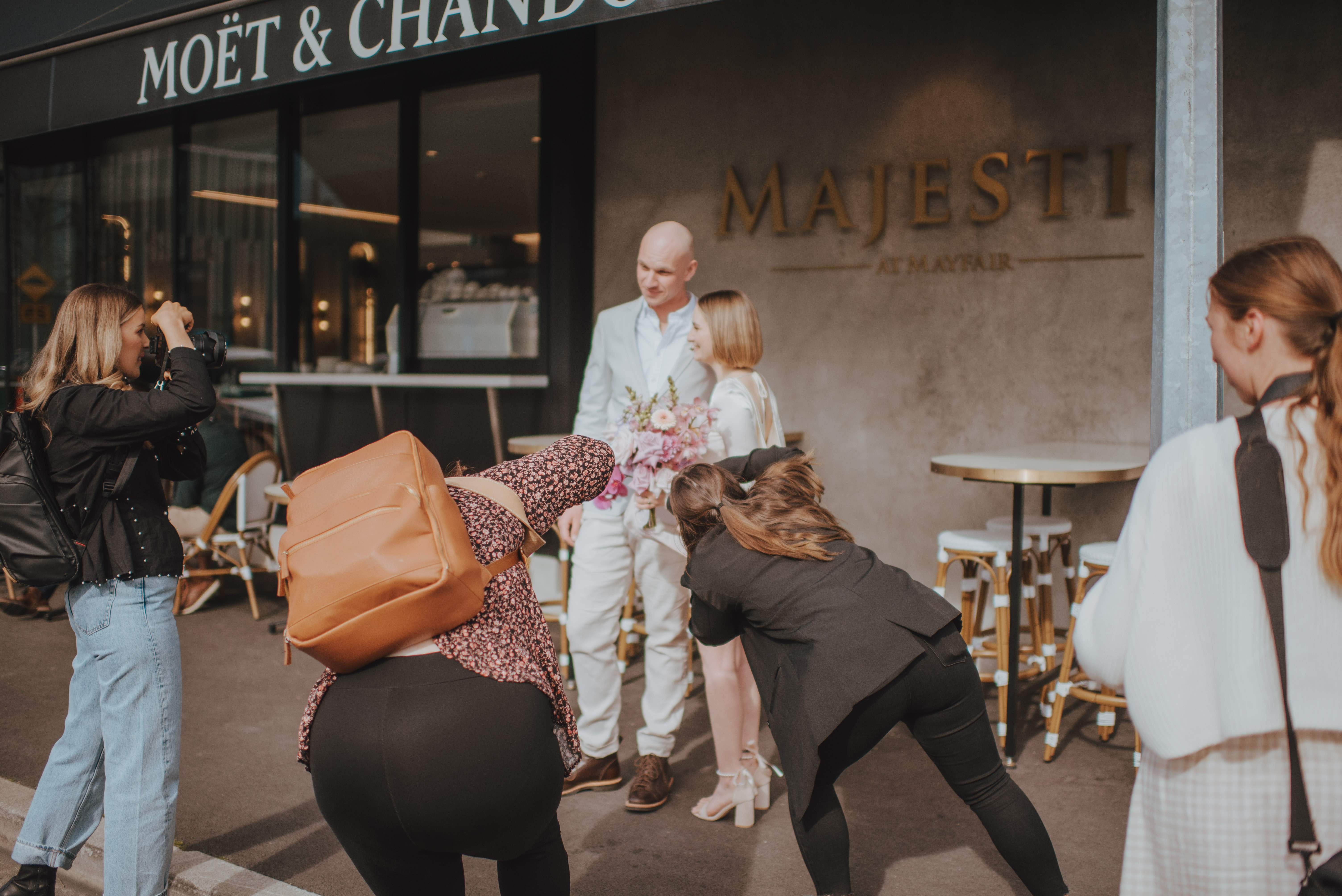 behind the scenes photo of all the photographers photographing the models