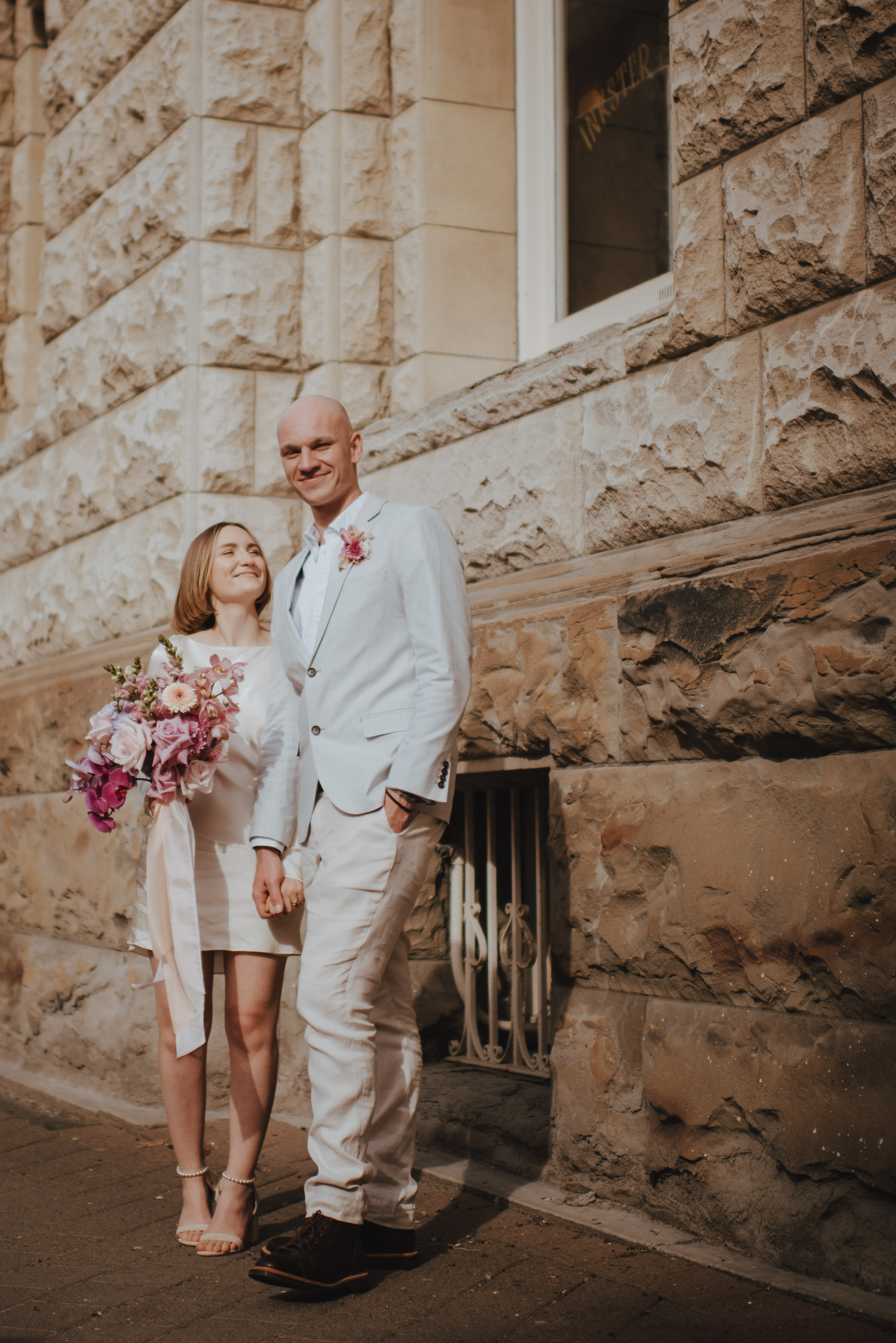 couple leaning against eachother outside O.G.B