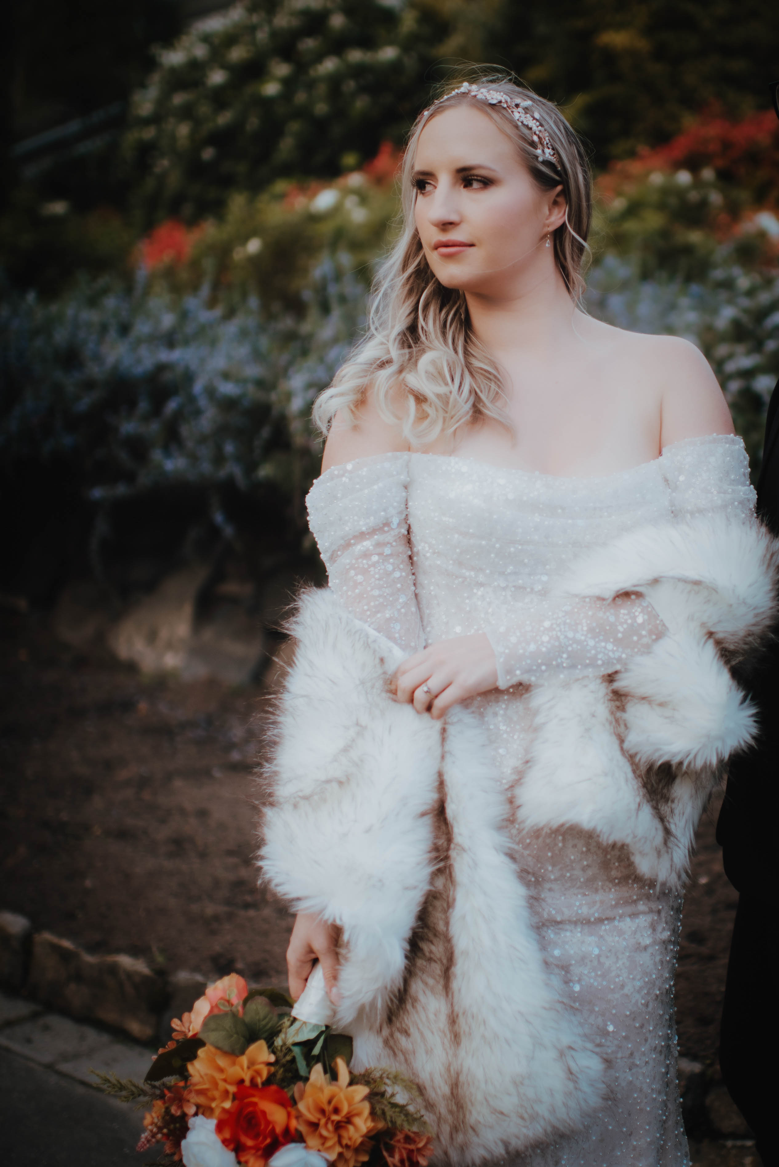 faux fur coat for hire in christchurch teamed with a Jerahmie Tricia Custom Gown