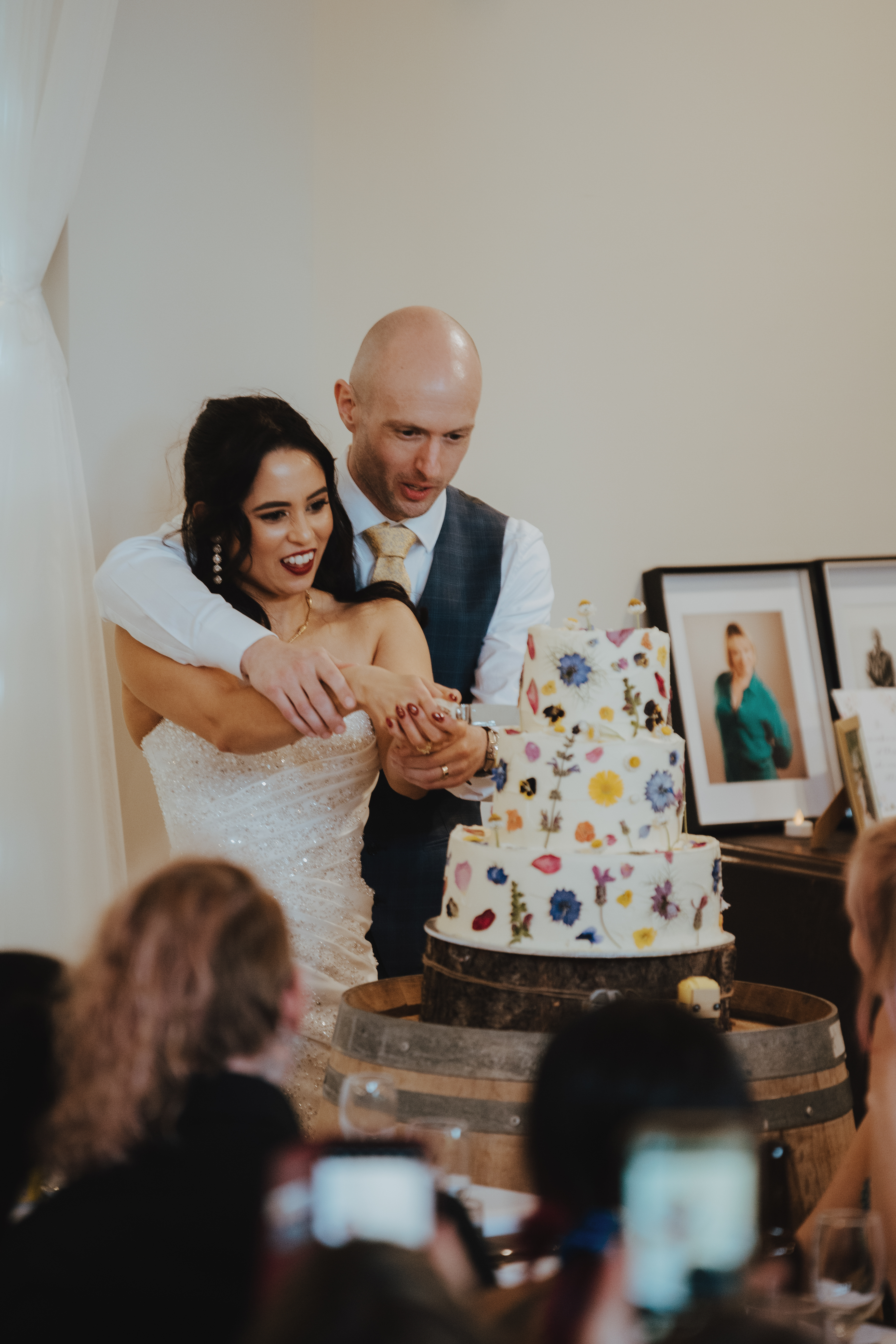 bride and groom cutting the cake decorated with Lord of the Rings characters
