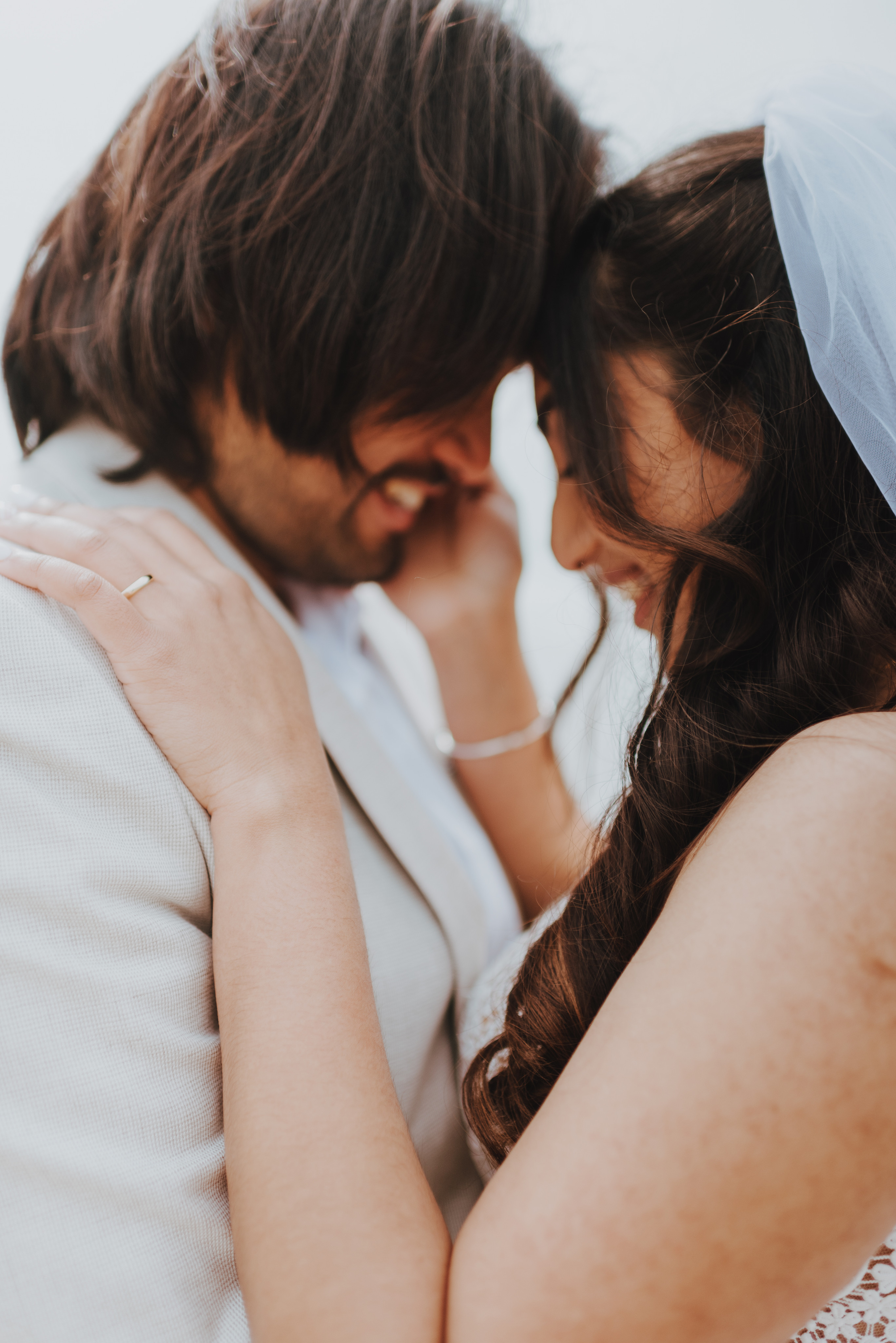 couple leaning into each other smiling