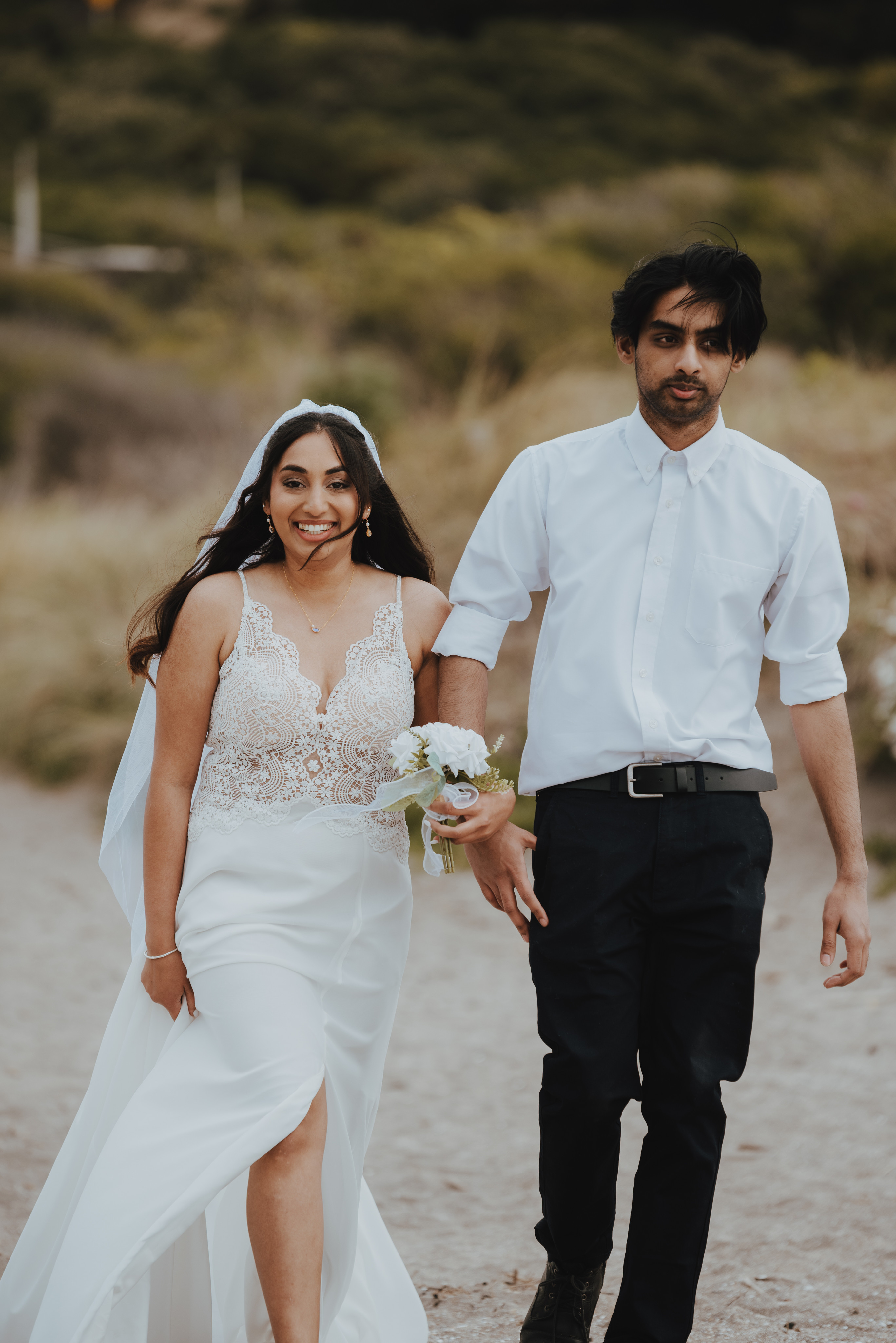 bride being walked down aisle by her brother