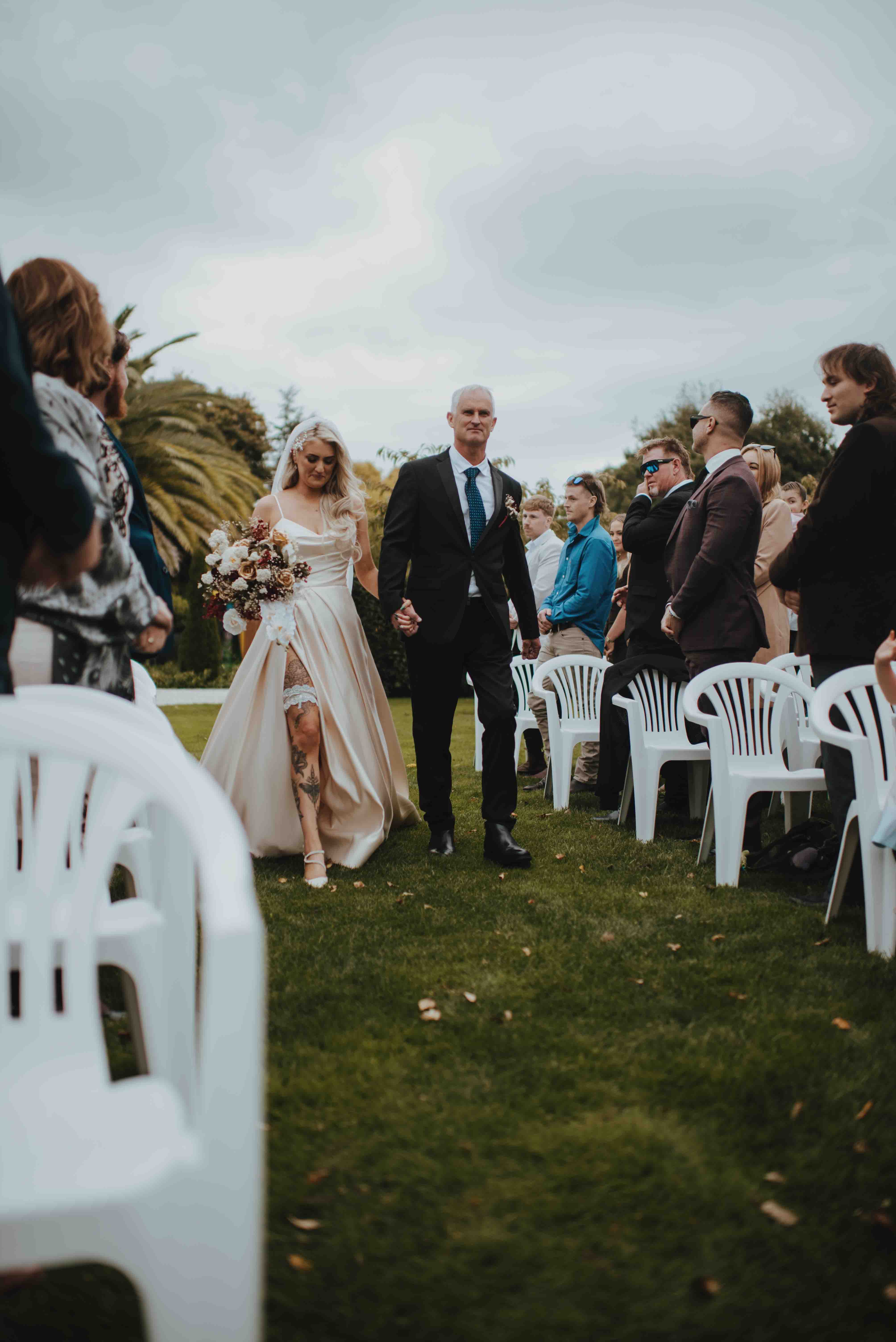 bride walking up the aisle with her father