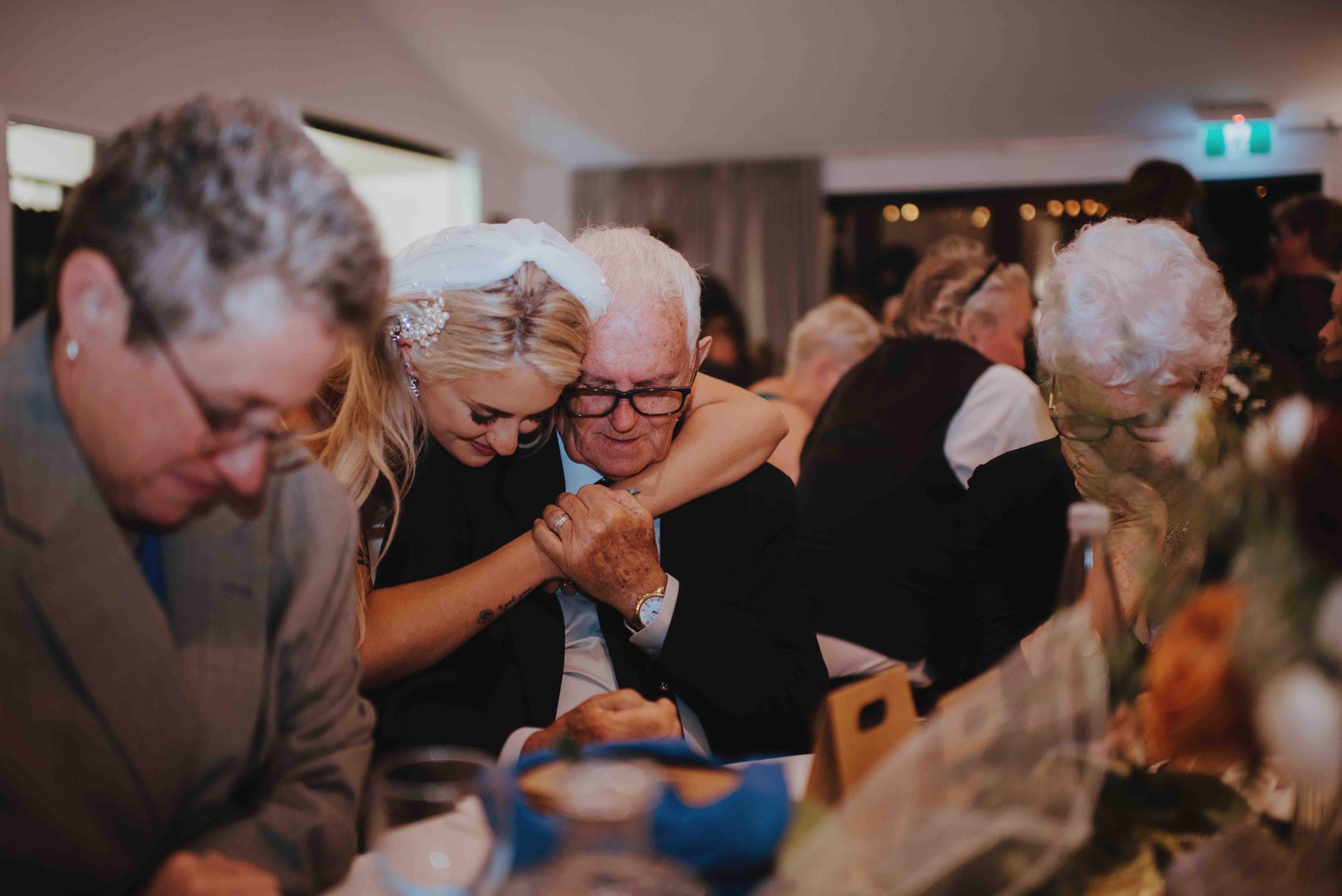 bride hugging a guest