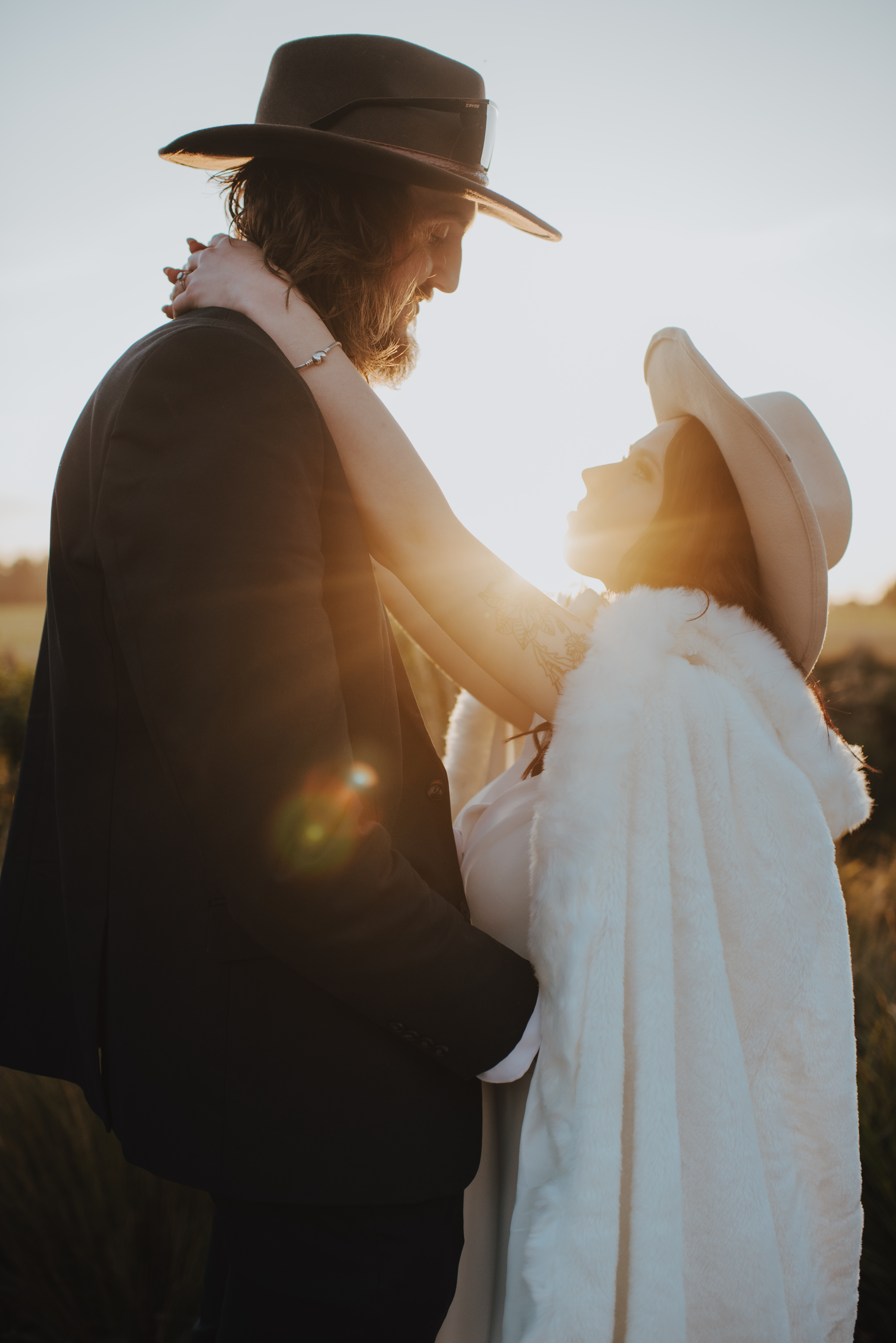 beautiful glow between couple for newlywed photos at sunset