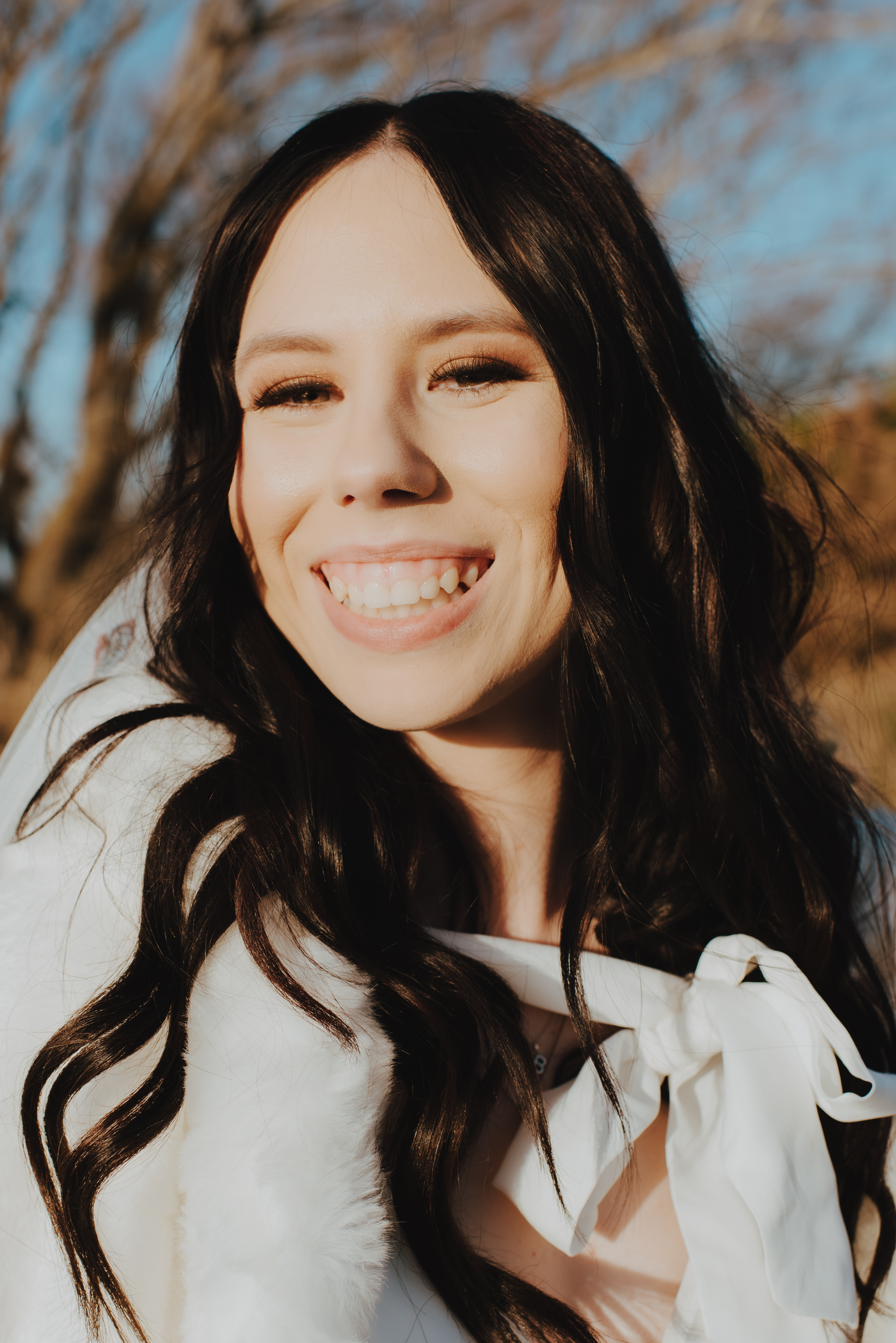 bride close up of her makeup laughing