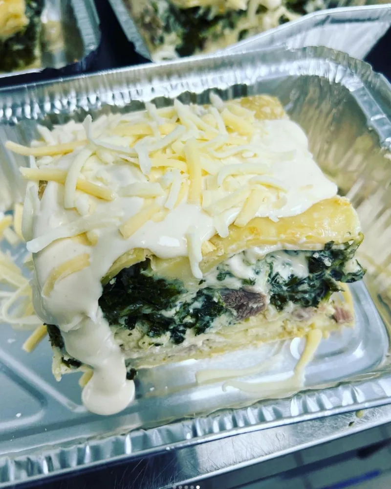 Spinach lasagna prepared as a take-home entree