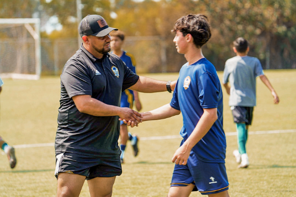 Coach Will giving instructions to the Ombee Select team. Coach Will giving instructions to the Ombee Select team.