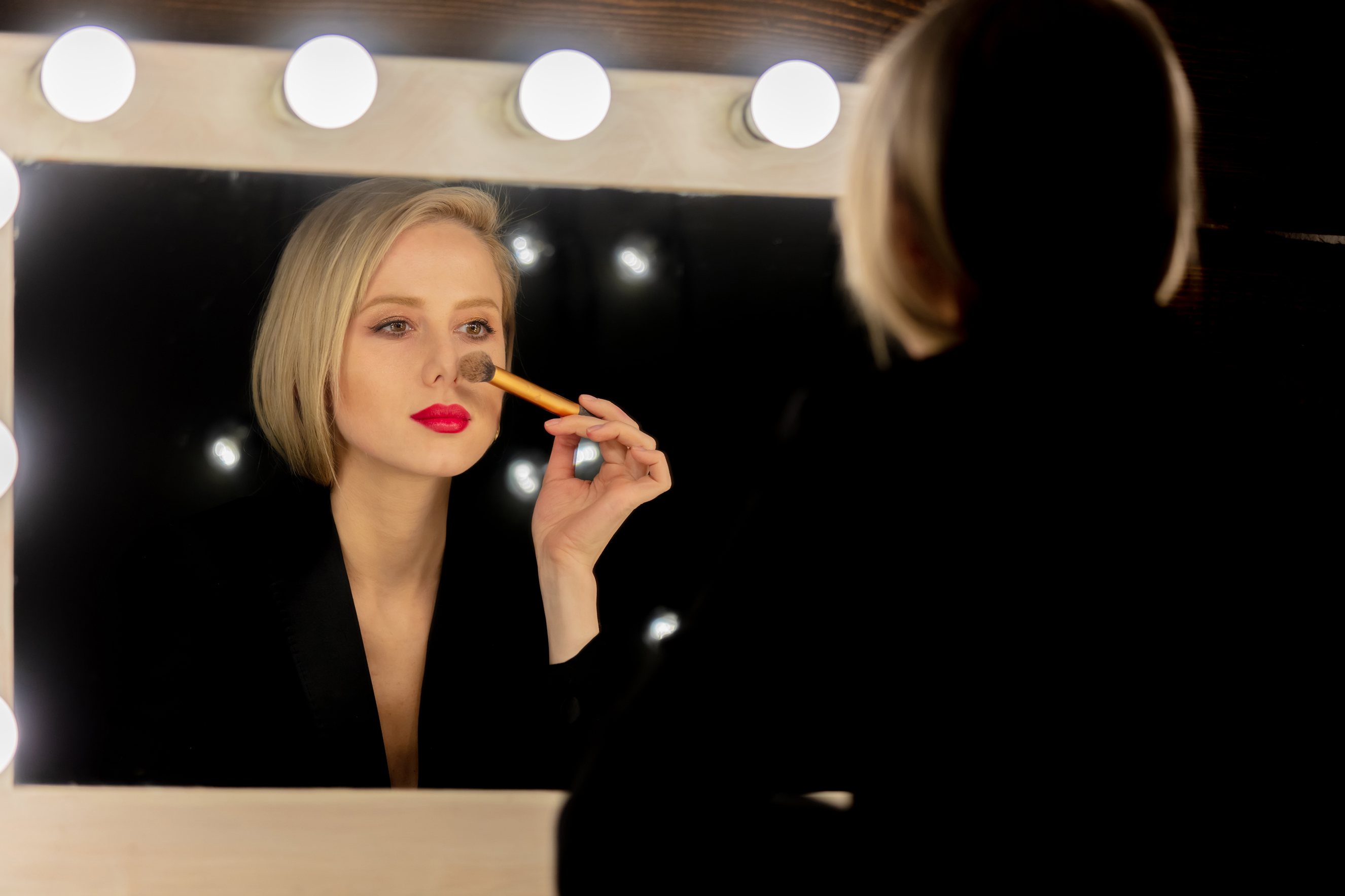 Women using face brush