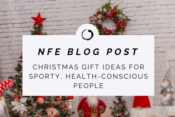 Text NFE BLOG POST. Christmas gift ideas for sporty, health-conscious people, with christmas tree in the background