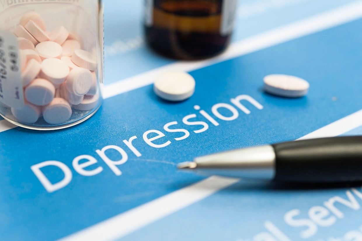 Medical Document "Depression" showcasing medication and pills with a pen