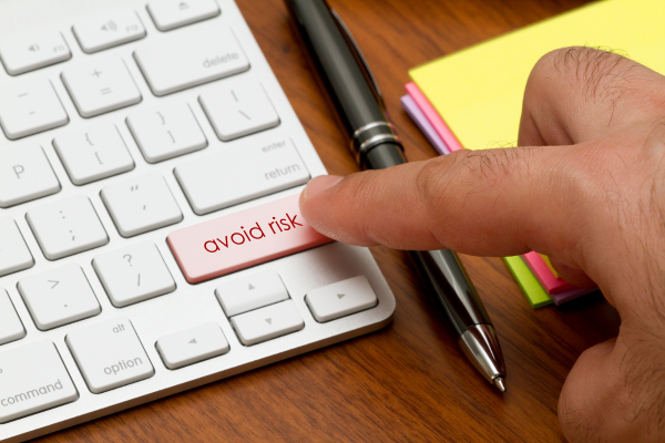 Keyboard key labeled 'Avoid Risk'