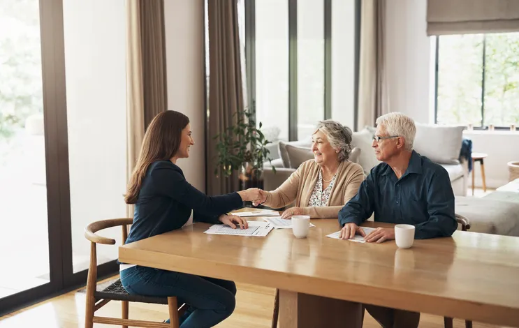 Mobile notary meeting with senior couple at home for estate plan signing Mobile notary meeting with senior couple at home for estate plan signing