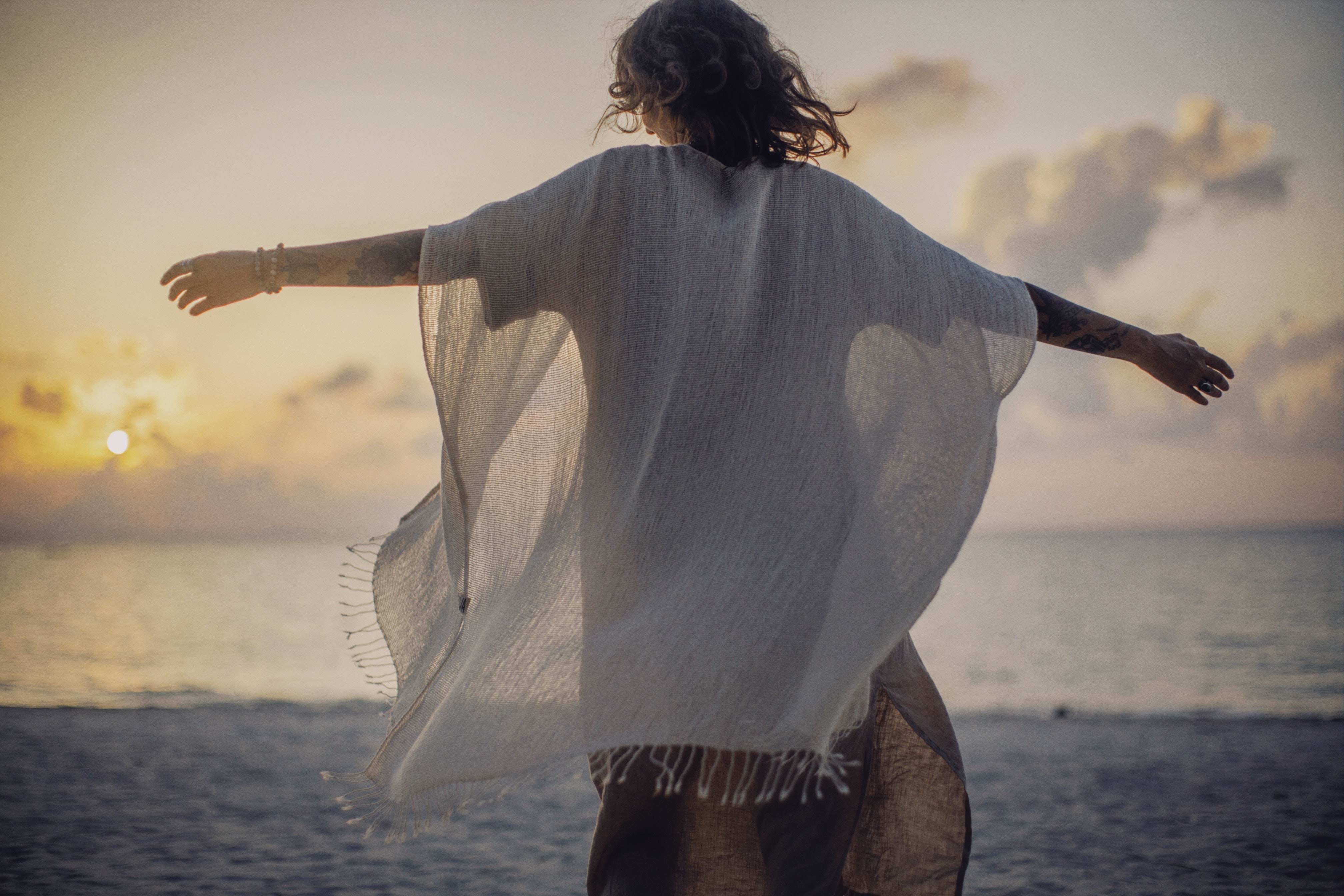 Silhouette of a woman near sea