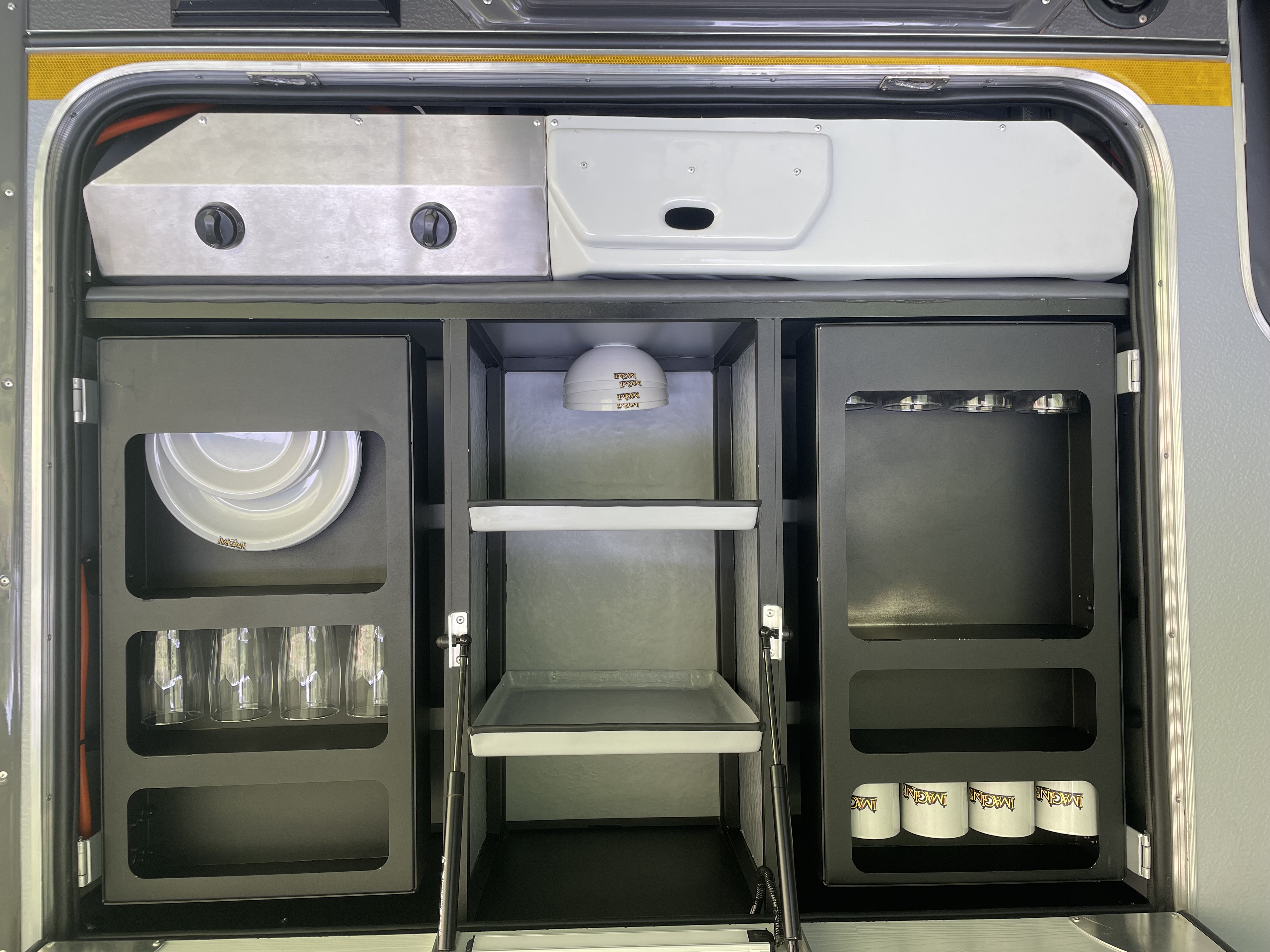 Full kitchen area with outer hatch open